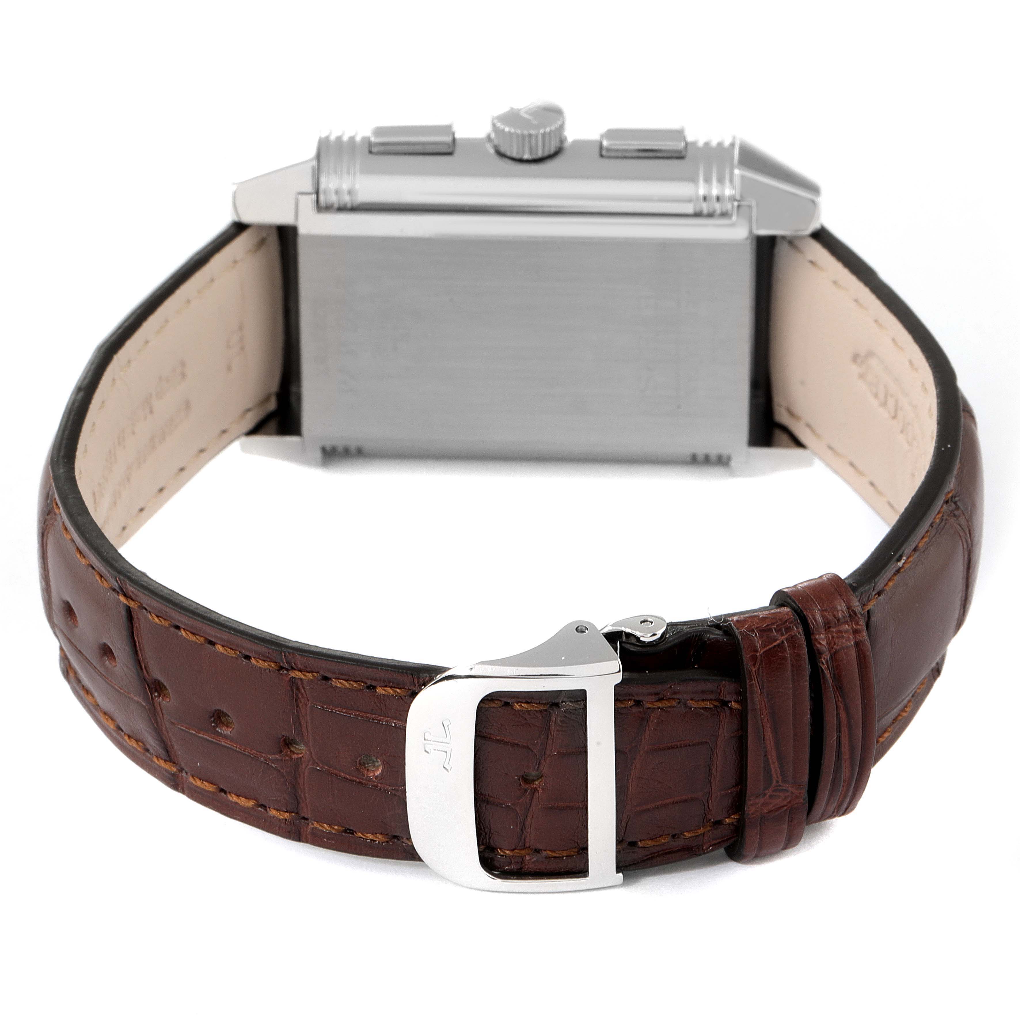 This image shows the back of a Jaeger-LeCoultre Reverso watch with a brown leather strap and buckle.