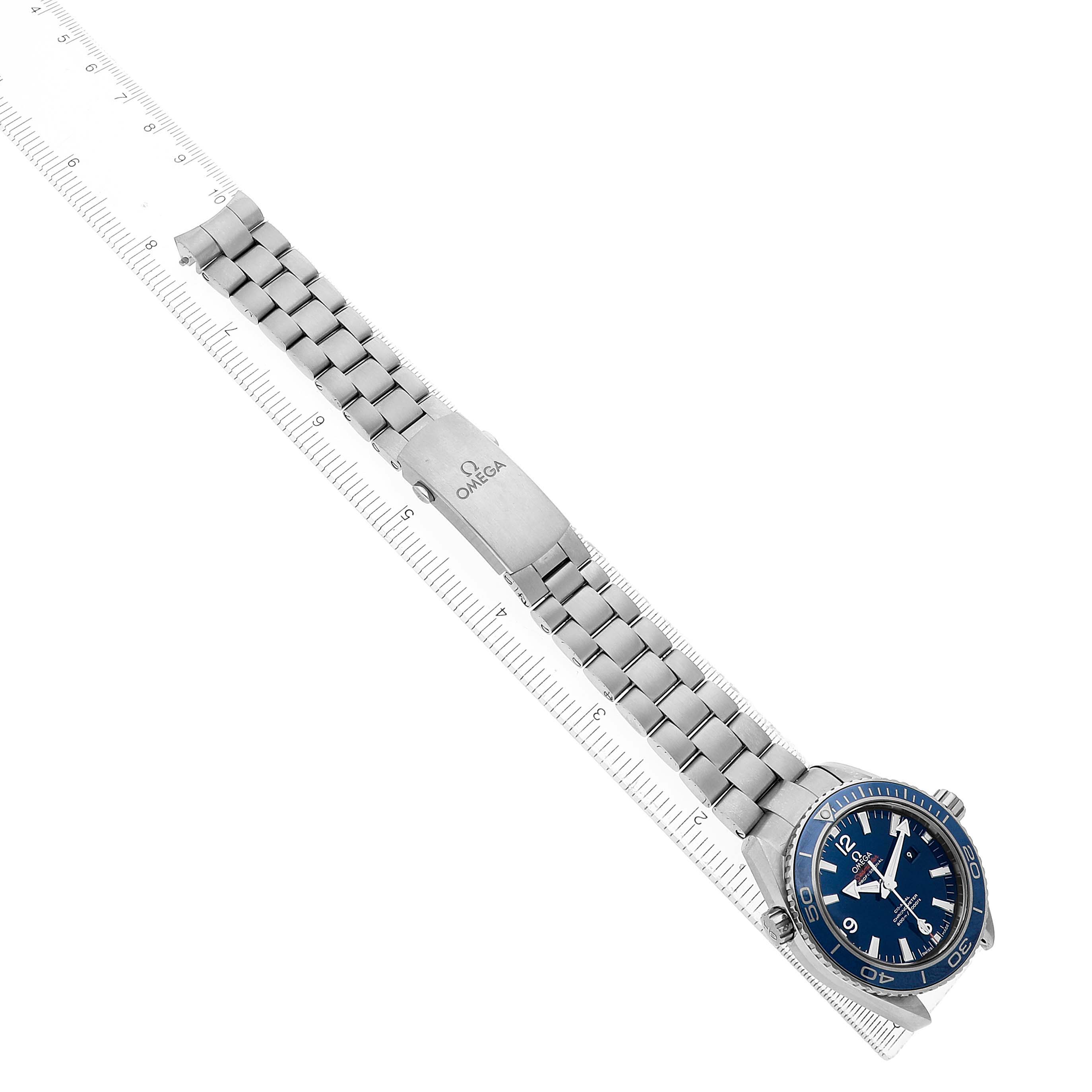 The Omega Planet Ocean 232.90.38.20.03.001 Men's Titanium Blue Dial watch is shown at an angle from the top, displaying the dial, bezel, bracelet, and clasp.