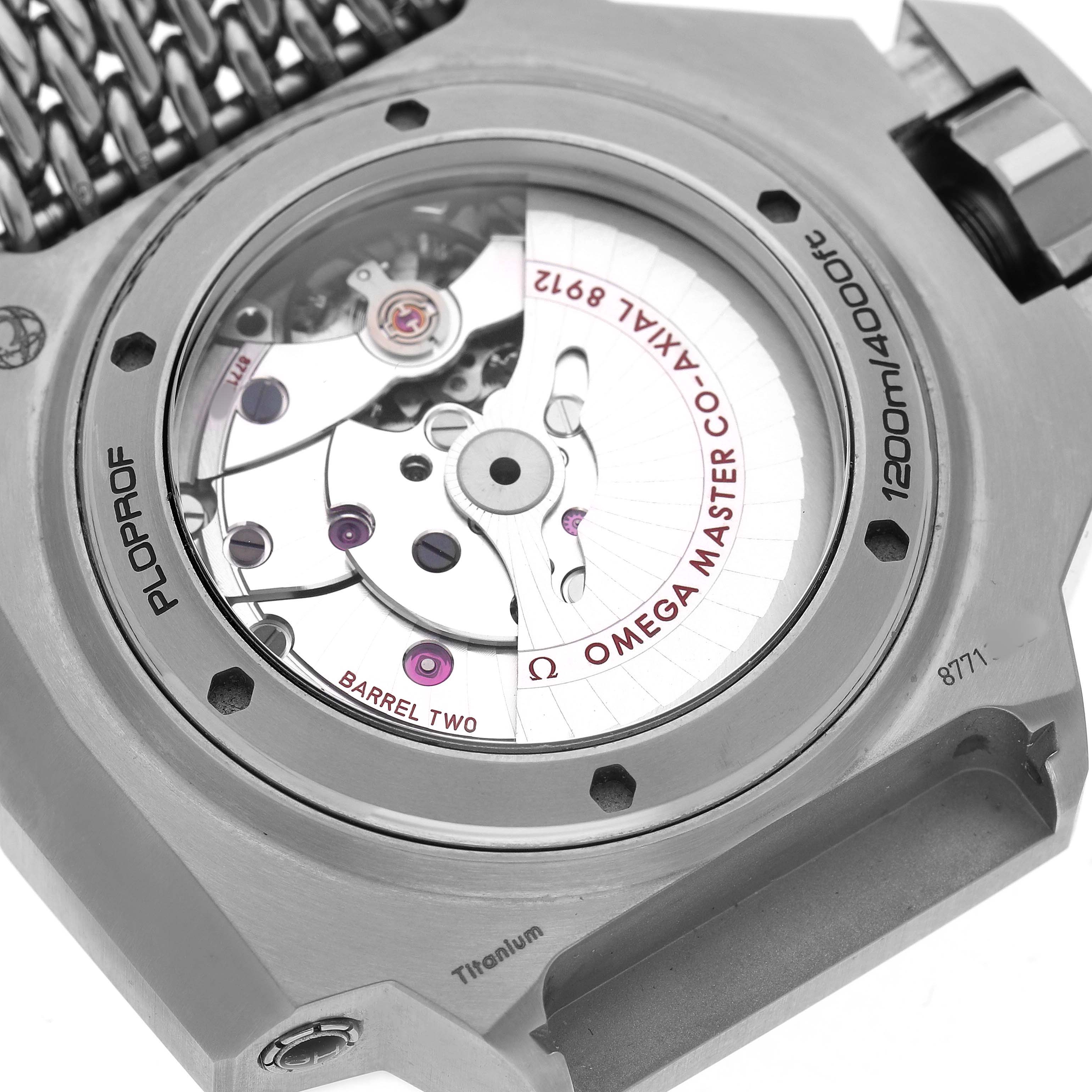 The Omega Ploprof 227.90.55.21.99.002 Men's Titanium Grey Dial's back casing is shown, highlighting the movement mechanism through a transparent case back.