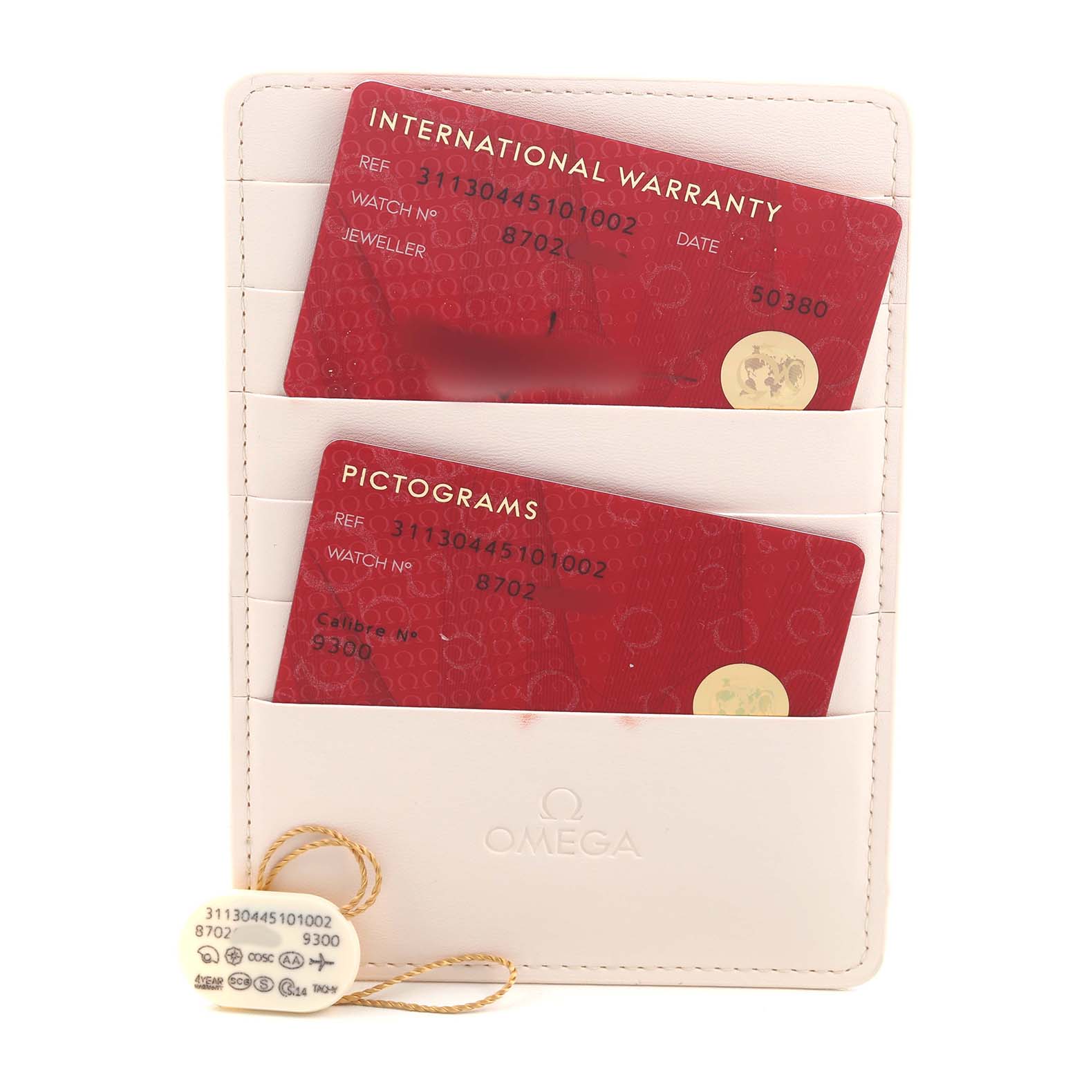 The image shows Omega Speedmaster 311.30.44.51.01.002 Men's Stainless Steel Black Dial accessories, including warranty and pictogram cards in a branded cardholder with a tag.