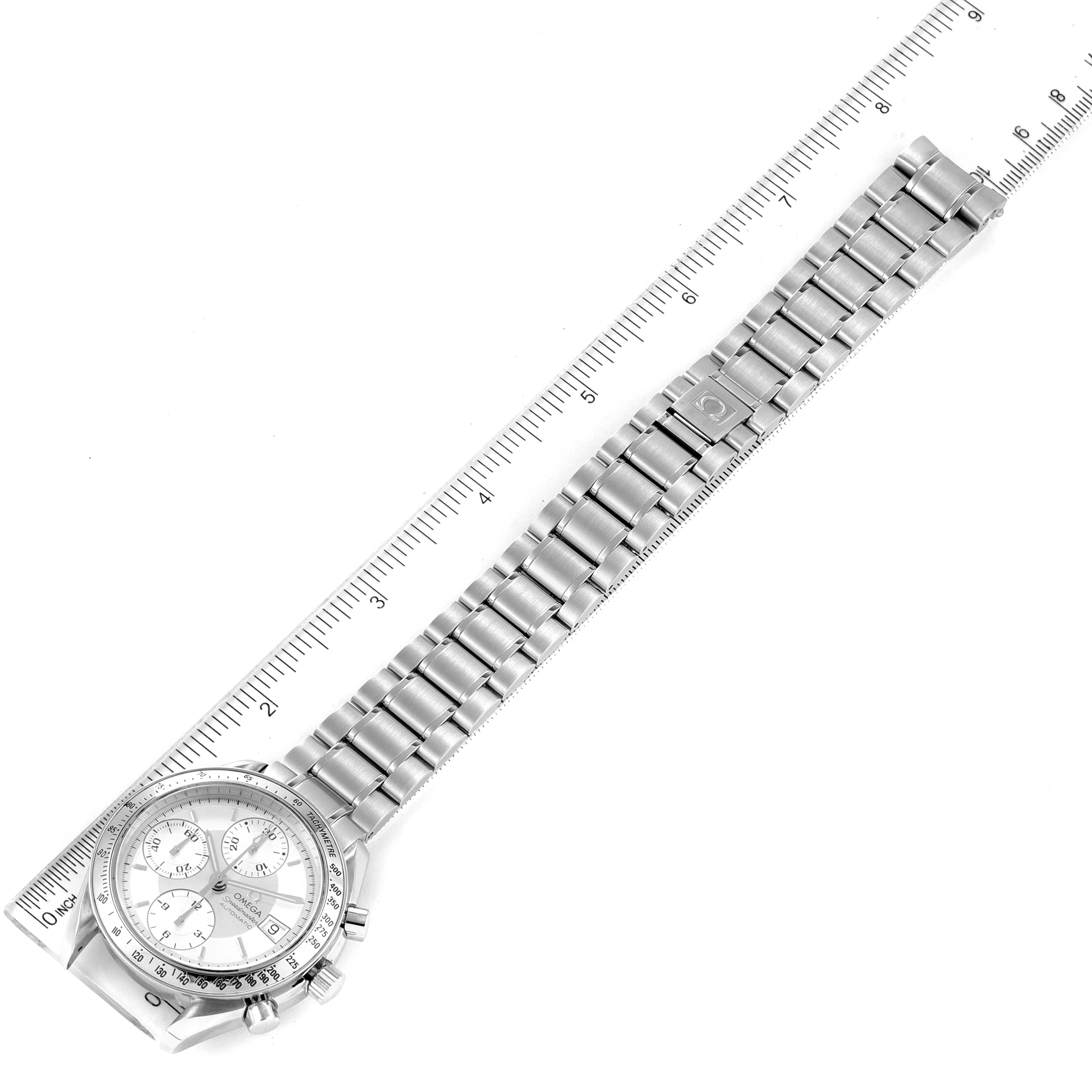 This image shows an Omega Speedmaster 3513.30.00 Men
s Stainless Steel Silver Dial 3513.30.00 Men
s Stainless Steel Silver Dial watch laid flat with the face, bracelet, and clasp visible, measured against a ruler.