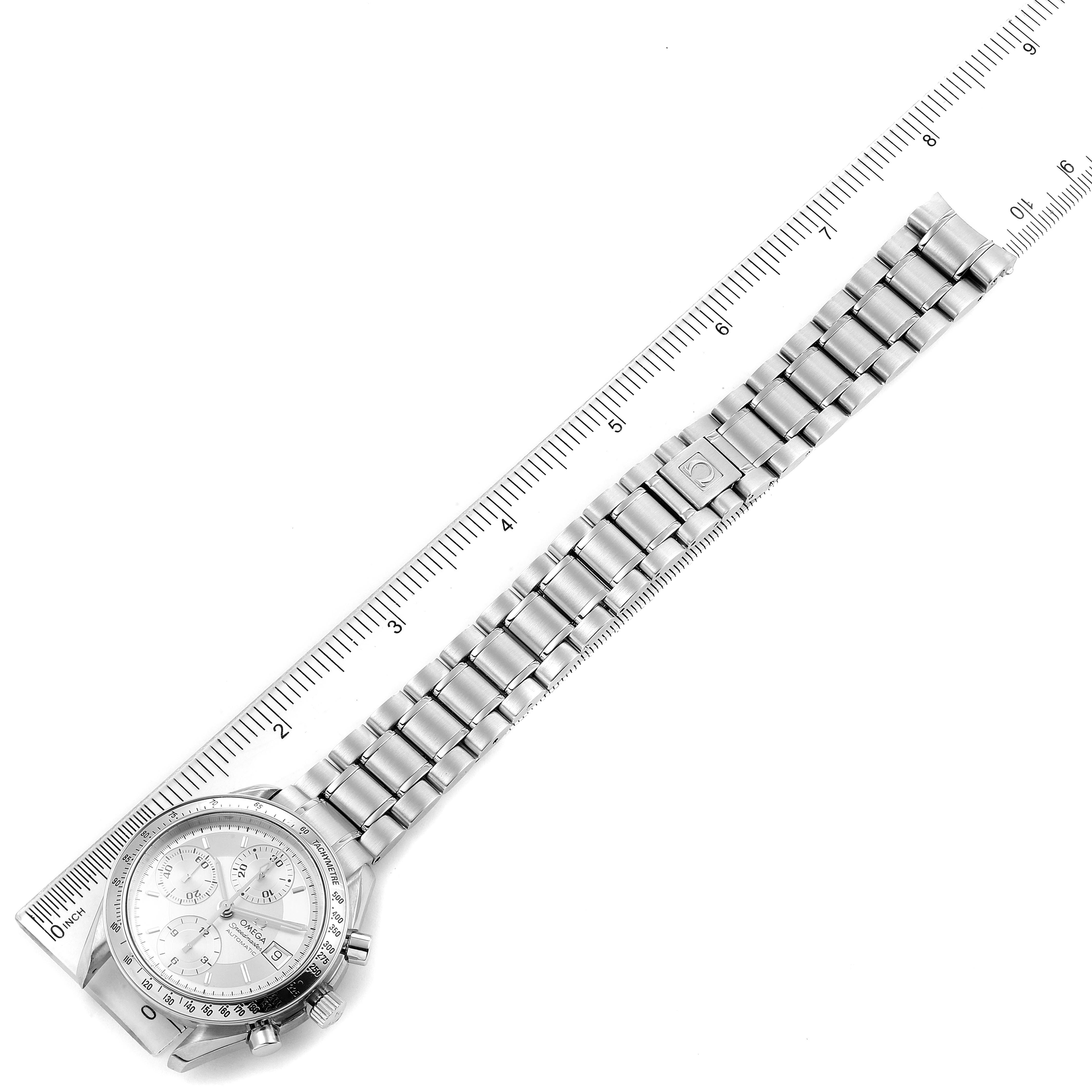 The image shows an Omega Speedmaster 3513.30.00 Men
s Stainless Steel Silver Dial 3513.30.00 Men
s Stainless Steel Silver Dial watch laid flat with a ruler measuring its length, highlighting the strap and watch face.