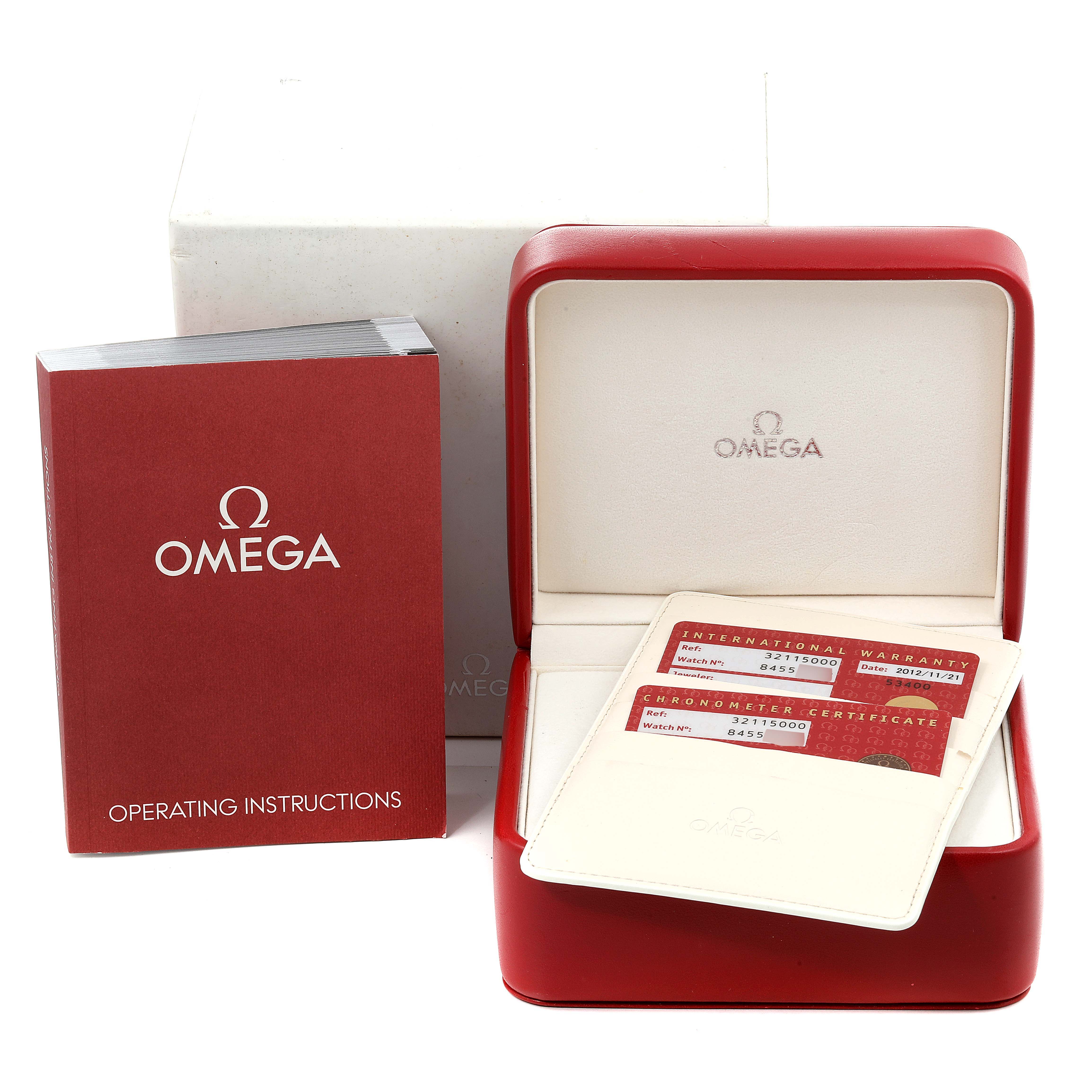 The image shows an Omega Speedmaster 3211.50.00 Men
s Stainless Steel Black Dial 3211.50.00 Men
s Stainless Steel Black Dial watch set with its box, warranty cards, and operating instructions from a front angle.