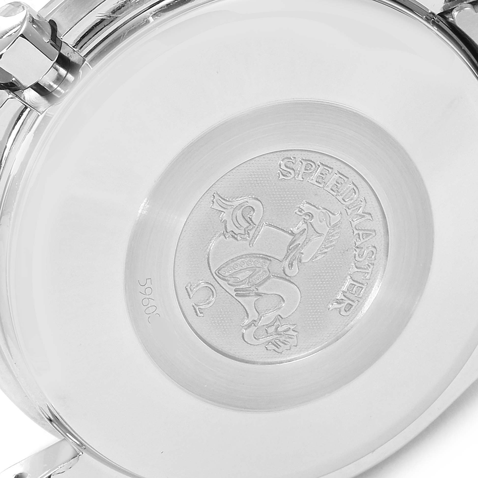 This image shows the engraved case back of an Omega Speedmaster 3523.30.00 Men's Stainless Steel Silver Dial 3523.30.00 Men's Stainless Steel Silver Dial watch from a top-down angle.