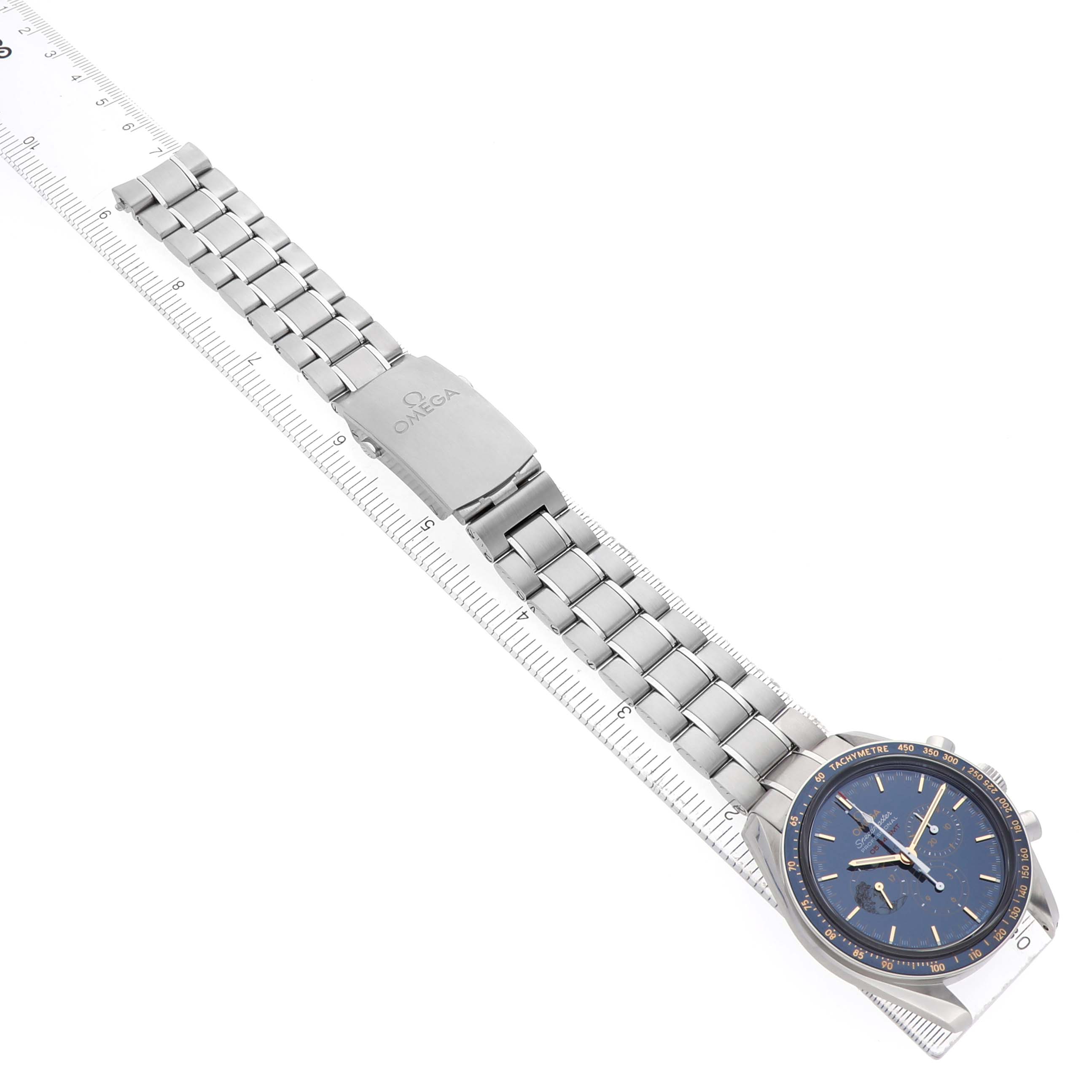 The Omega Speedmaster 311.30.42.30.03.001 Men's Stainless Steel Blue Dial watch is shown from an angled top view, highlighting the face, bezel, and full metal bracelet.