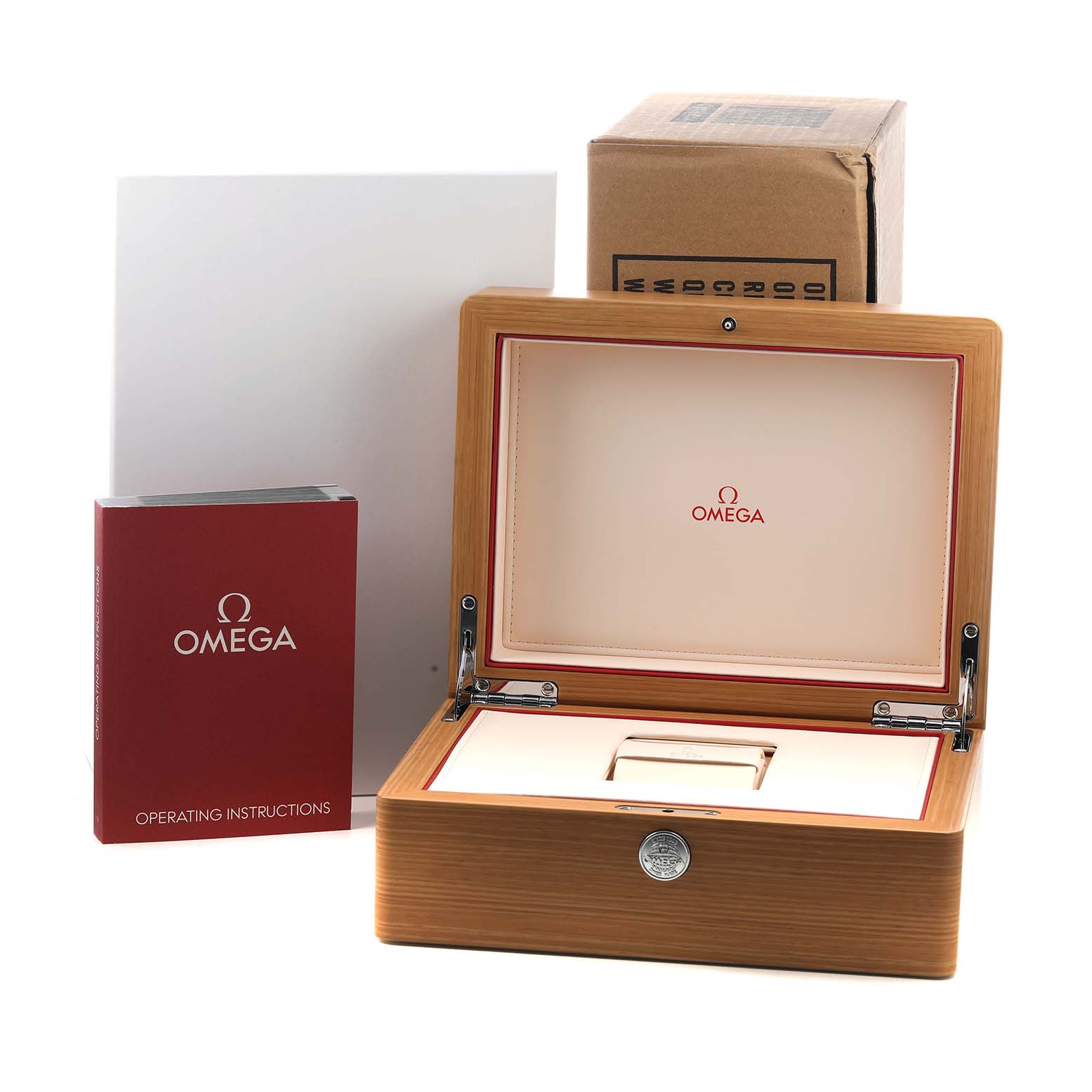 The image shows an Omega Speedmaster 311.90.44.51.03.001 Men's Titanium Blue Dial box, operating instructions, and outer packaging from a front angle.