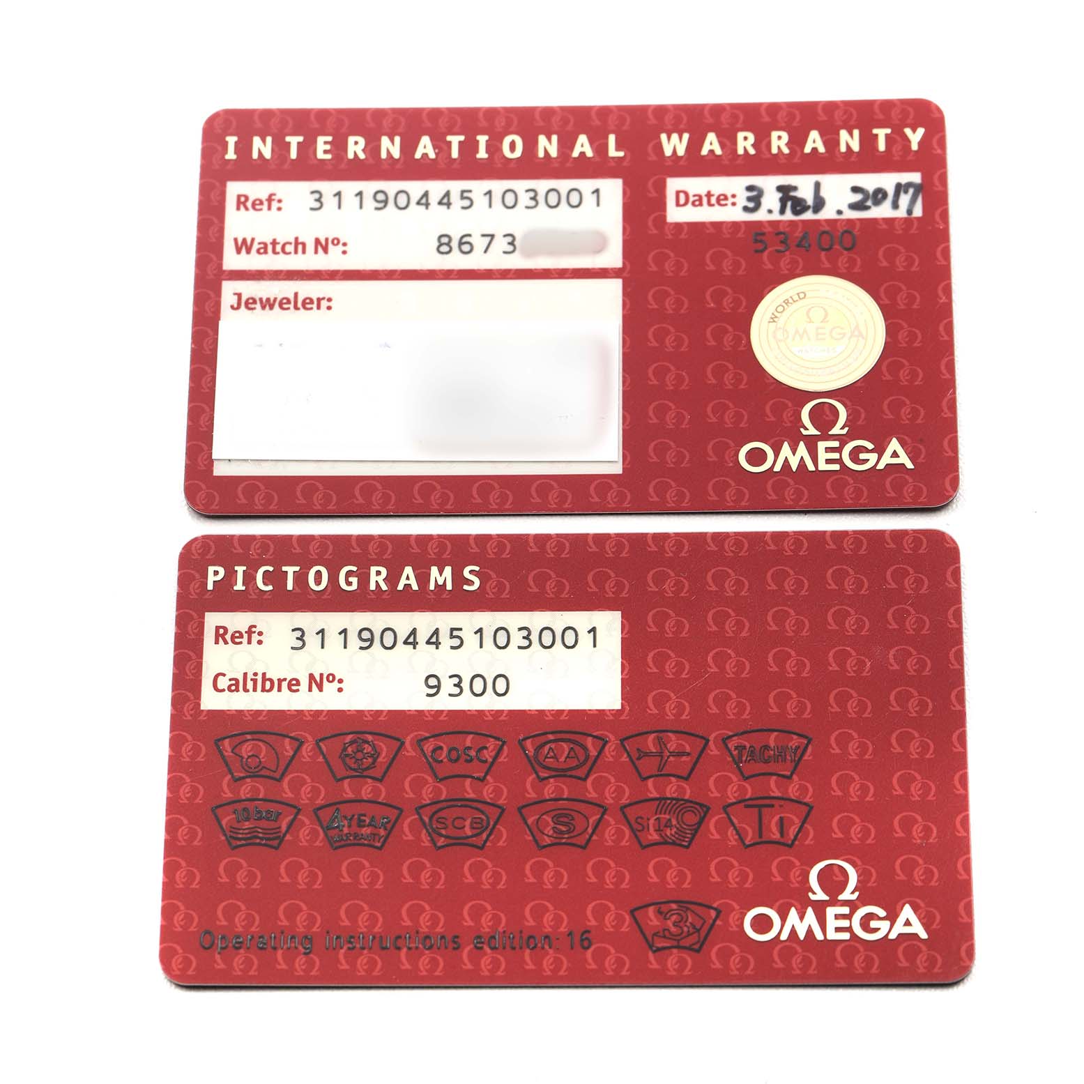 The image shows two warranty and pictogram cards for the Omega Speedmaster 311.90.44.51.03.001 Men's Titanium Blue Dial model, displayed flat with details visible.