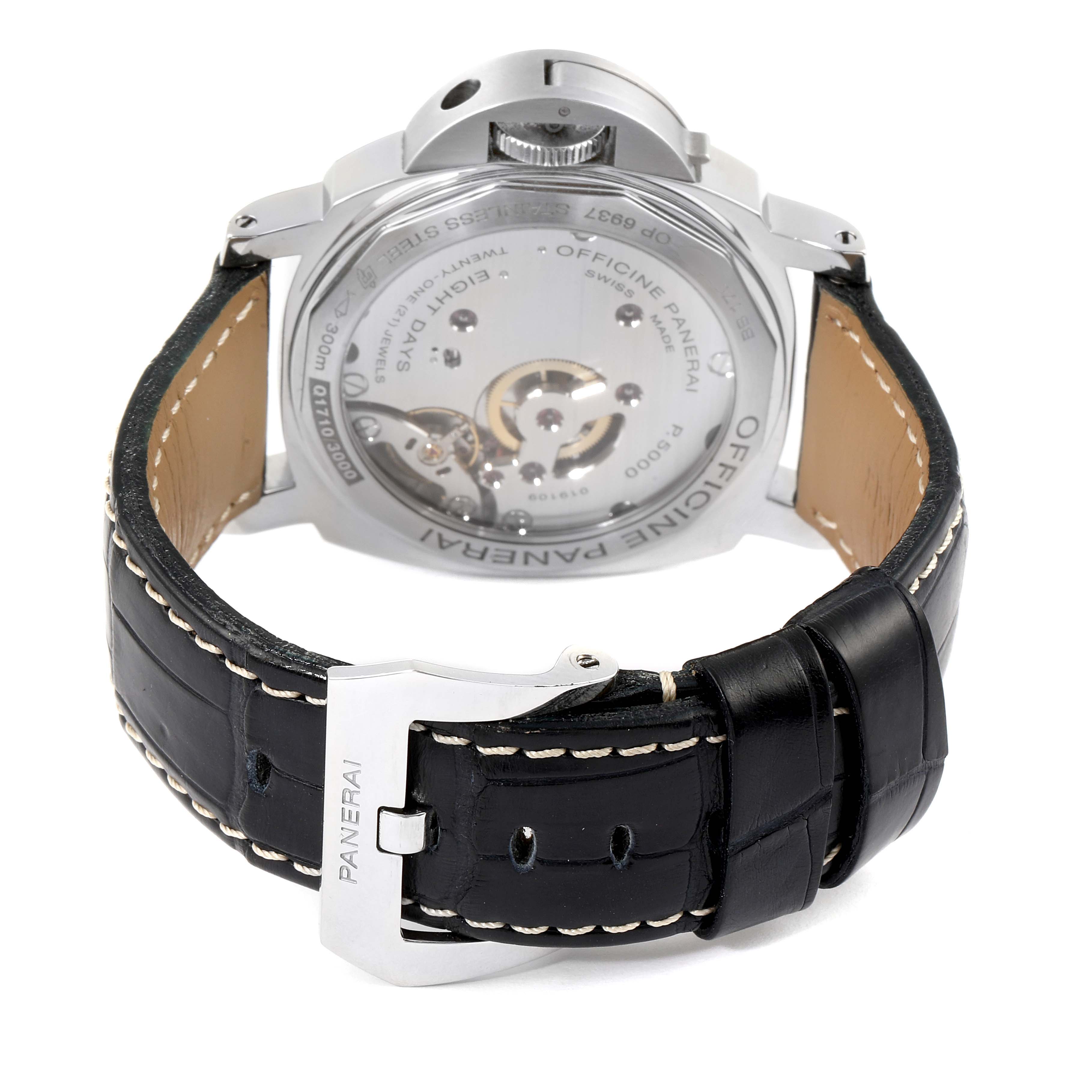 The image shows the backside of the Panerai Luminor PAM00560 Men
s Stainless Steel Black Dial PAM00560 Men
s Stainless Steel Black Dial watch, featuring its movement and leather strap with a Panerai buckle.