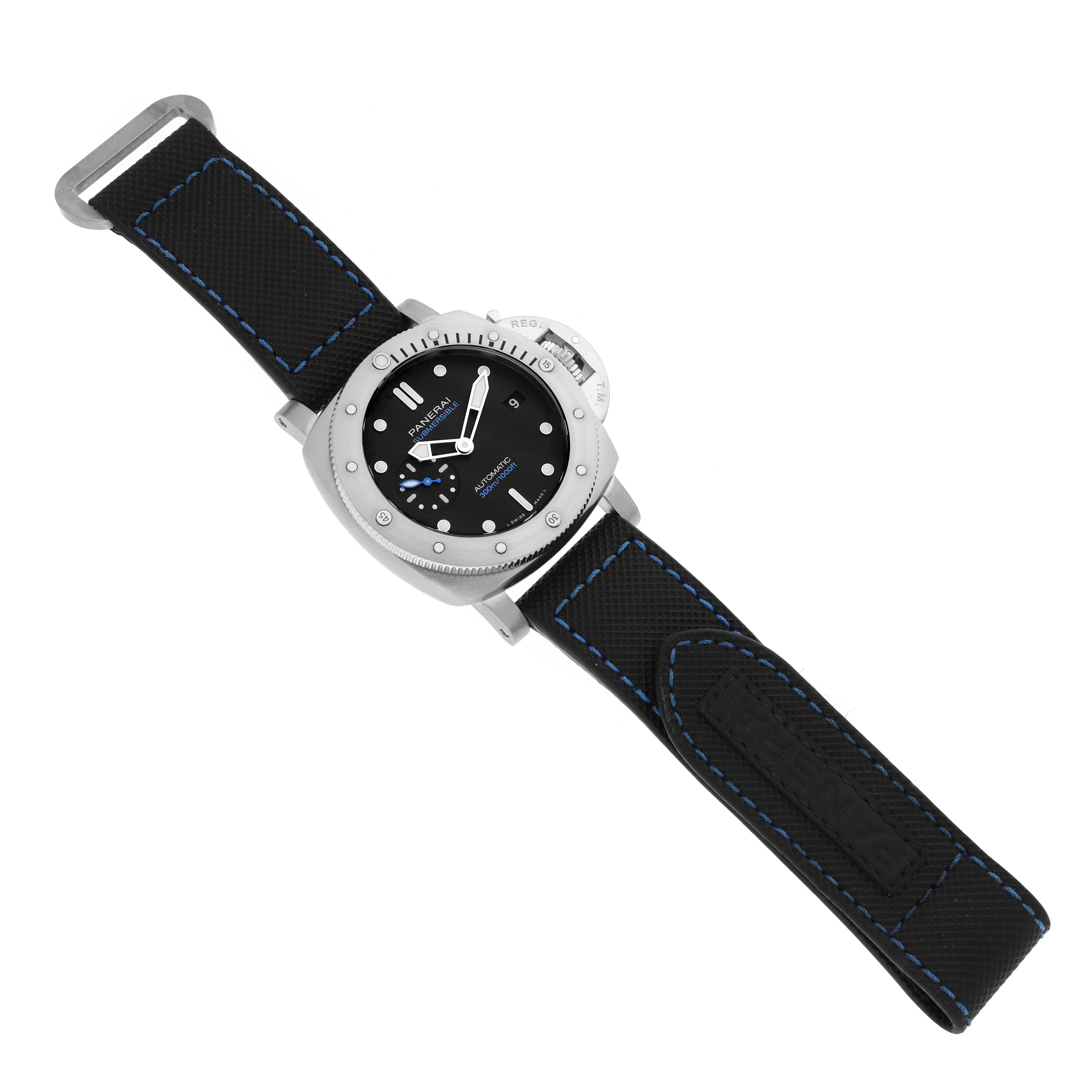 The Panerai Submersible PAM00973 Men's Stainless Steel Black Dial PAM00973 Men's Stainless Steel Black Dial is shown from a top-down angle, displaying the dial, bezel, case, and black strap with blue stitching.