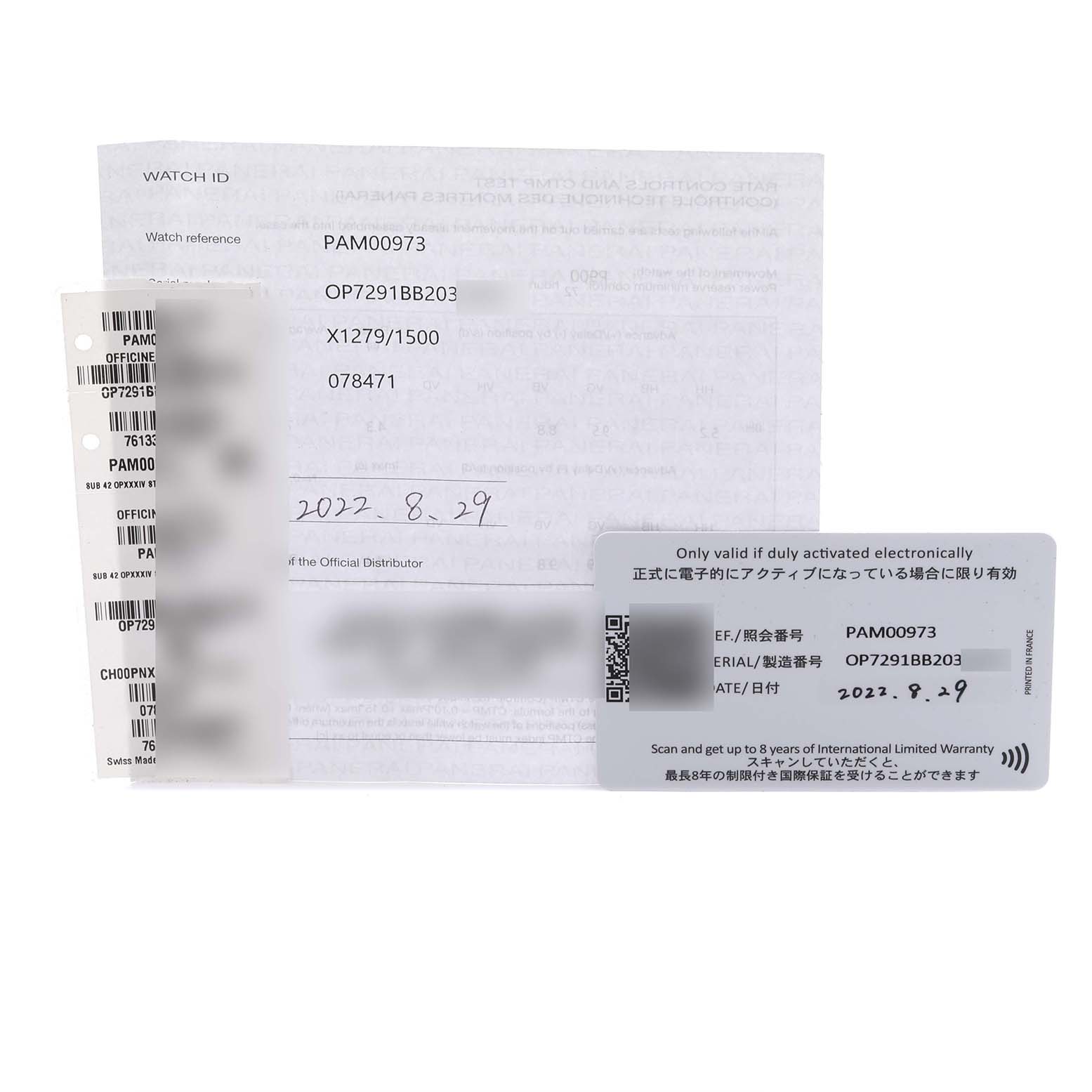 The image shows documents and cards related to the Panerai Submersible PAM00973 Men's Stainless Steel Black Dial PAM00973 Men's Stainless Steel Black Dial model, including warranty and product details.