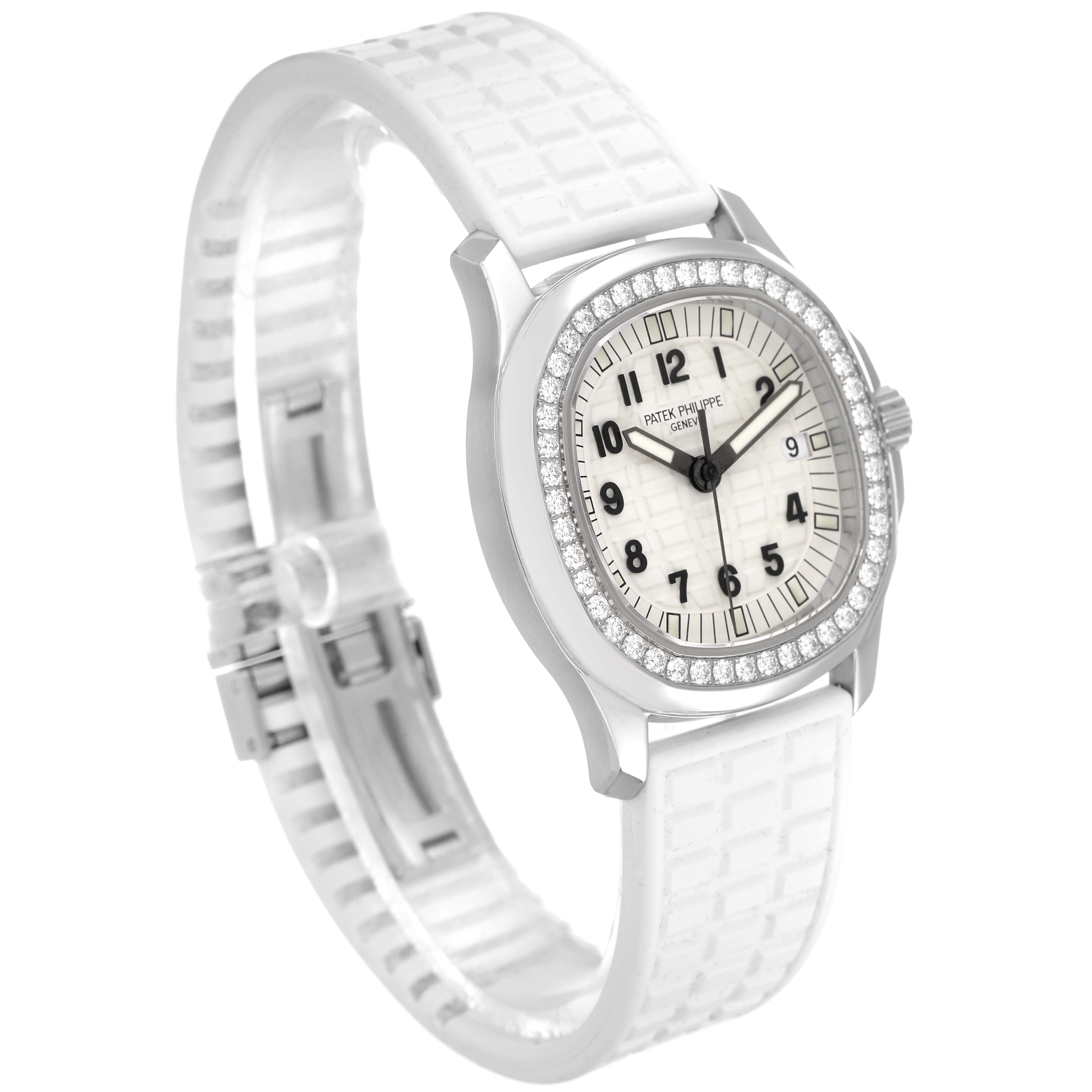 The image shows a side angle of a Patek Philippe Aquanaut 5067A Women's Stainless Steel White Dial 5067A Women's Stainless Steel White Dial watch with a white strap and diamond bezel.