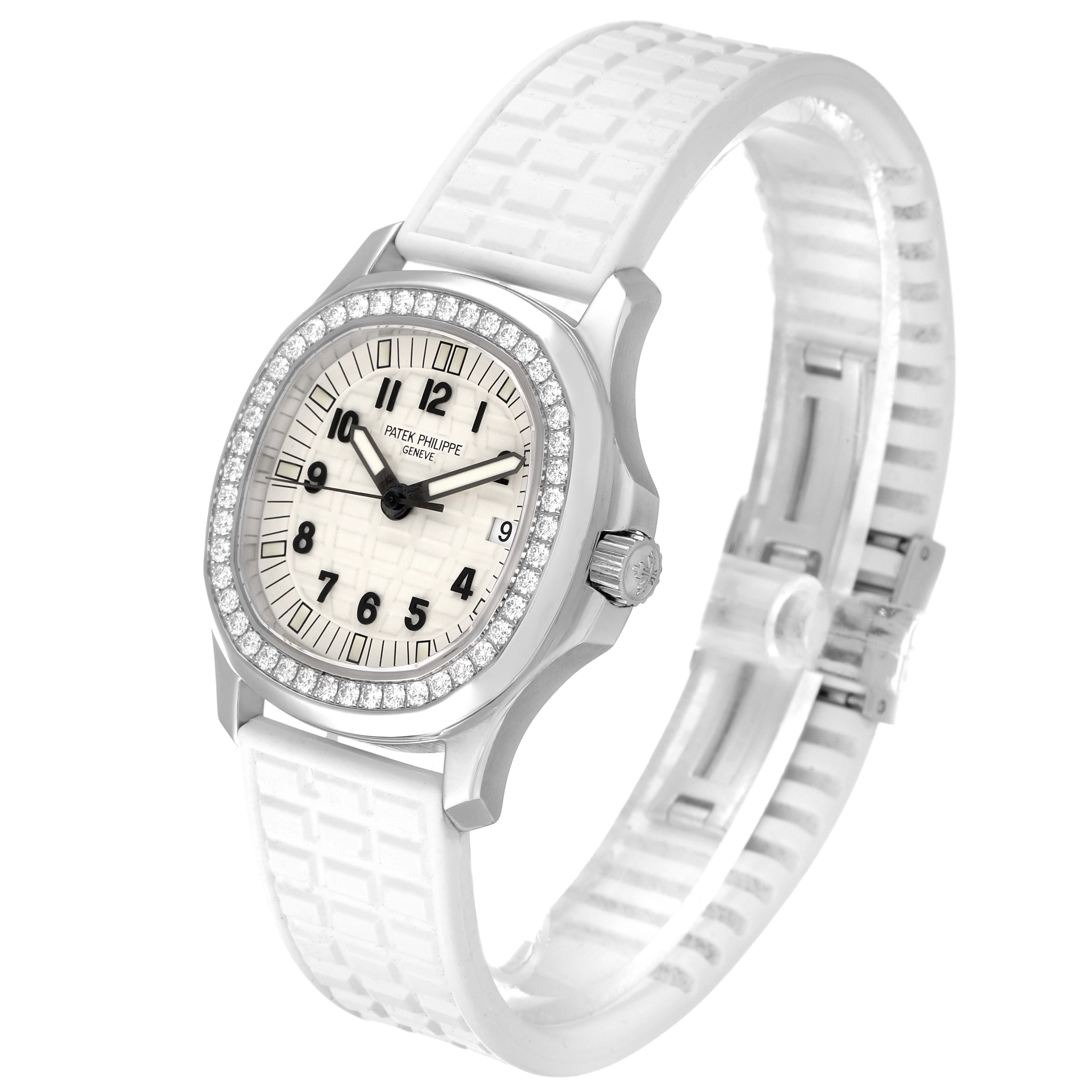 This image shows a Patek Philippe Aquanaut 5067A Women's Stainless Steel White Dial 5067A Women's Stainless Steel White Dial watch at a slight angle, displaying its dial, diamond bezel, and white rubber strap.