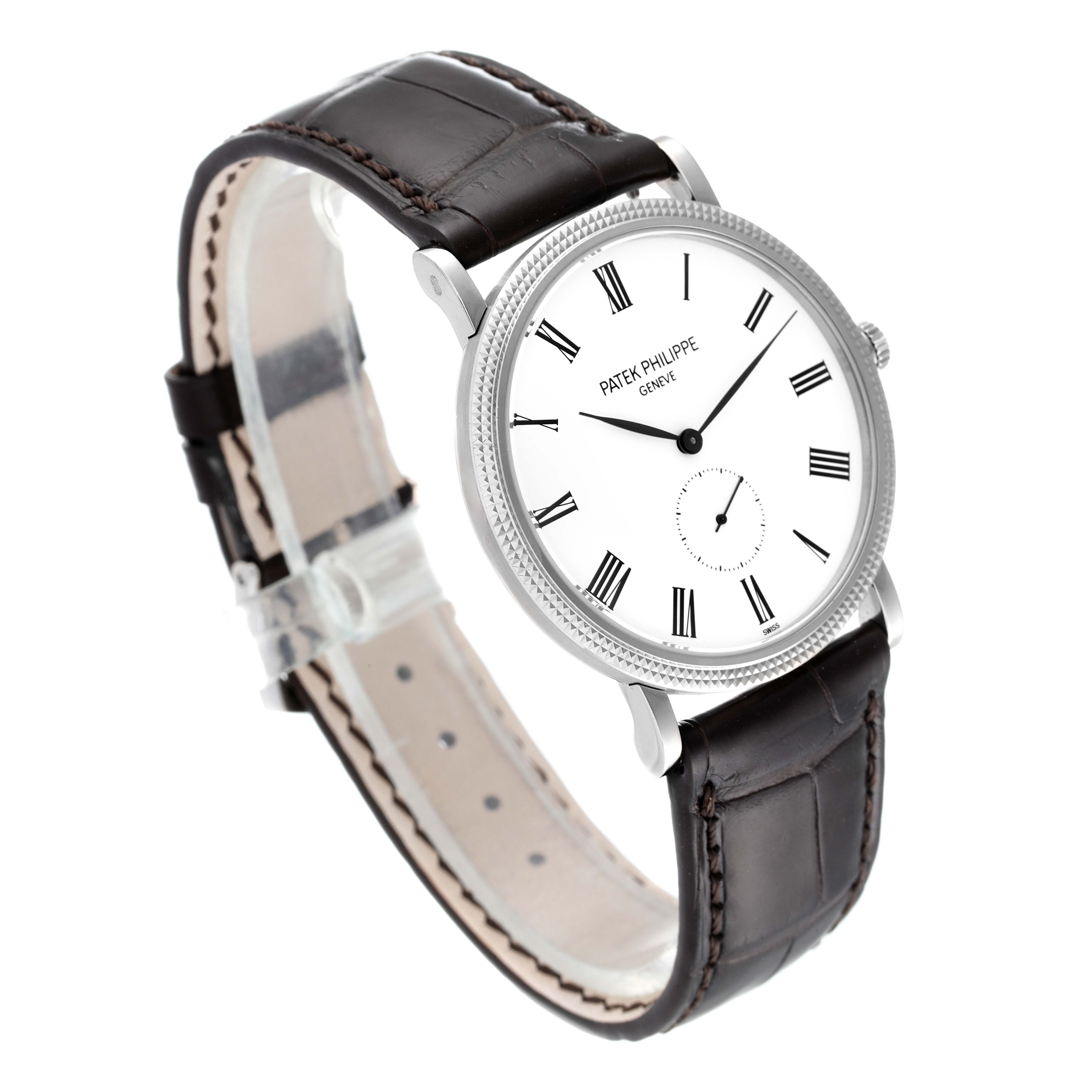 This image shows the Patek Philippe Calatrava 5119G Men
s White Gold White Dial 5119G Men
s White Gold White Dial watch at a three-quarter angle, highlighting its face, bezel, and leather strap.