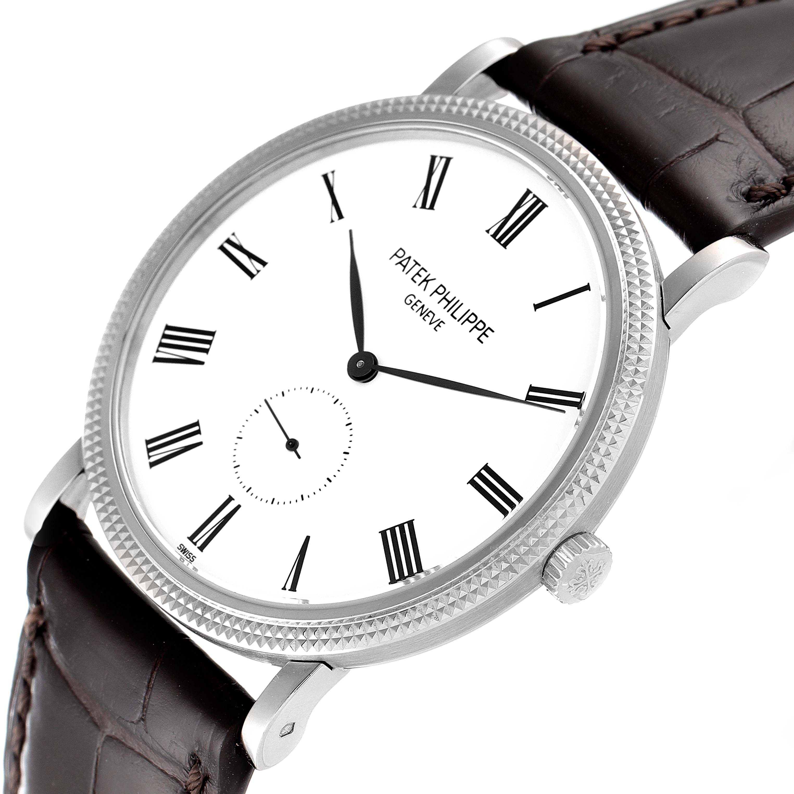 The image shows a close-up, angled view of a Patek Philippe Calatrava 5119G Men
s White Gold White Dial 5119G Men
s White Gold White Dial watch with a white dial and black leather strap.