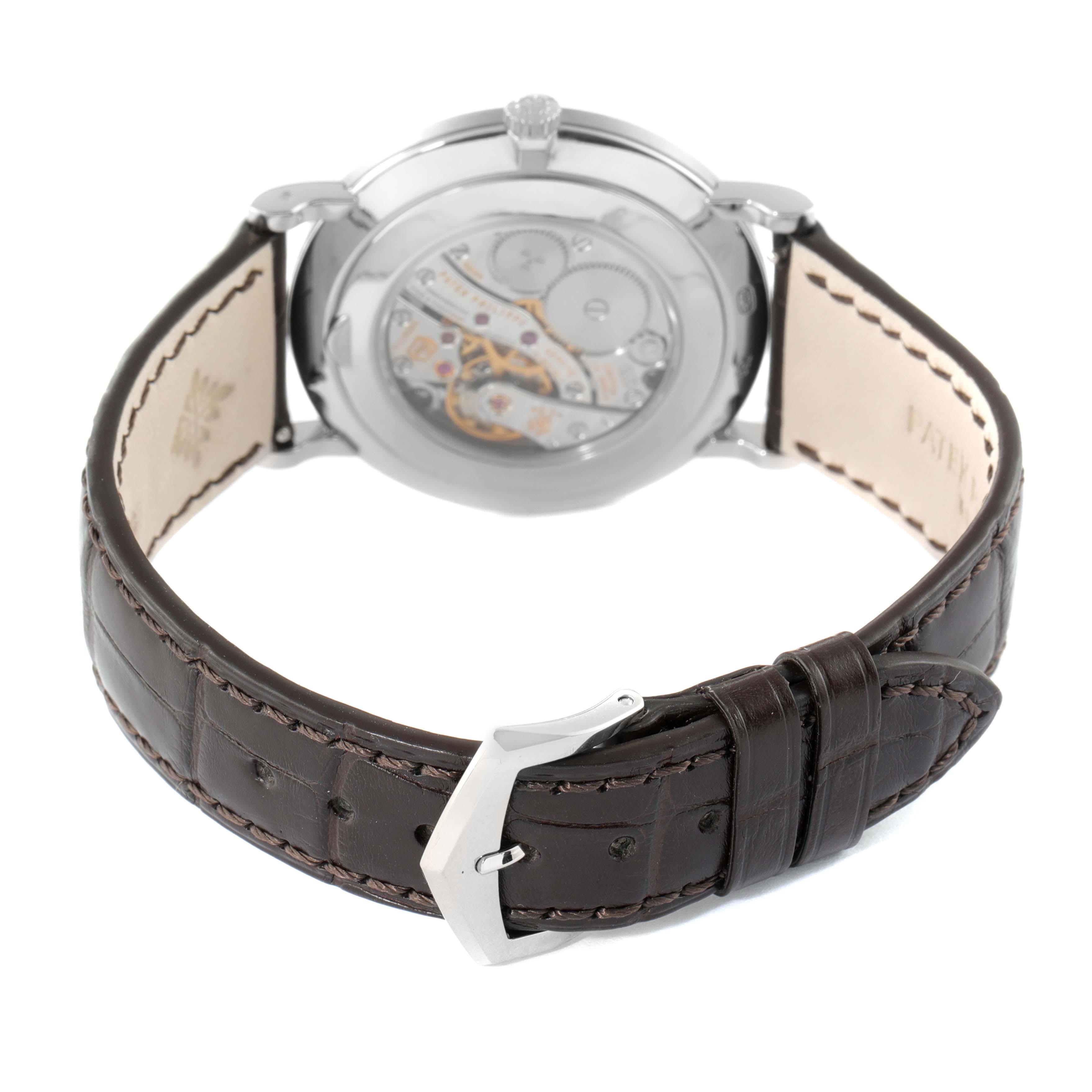 This image shows the back view of a Patek Philippe Calatrava 5119G Men
s White Gold White Dial 5119G Men
s White Gold White Dial watch, highlighting its leather strap and transparent case back.
