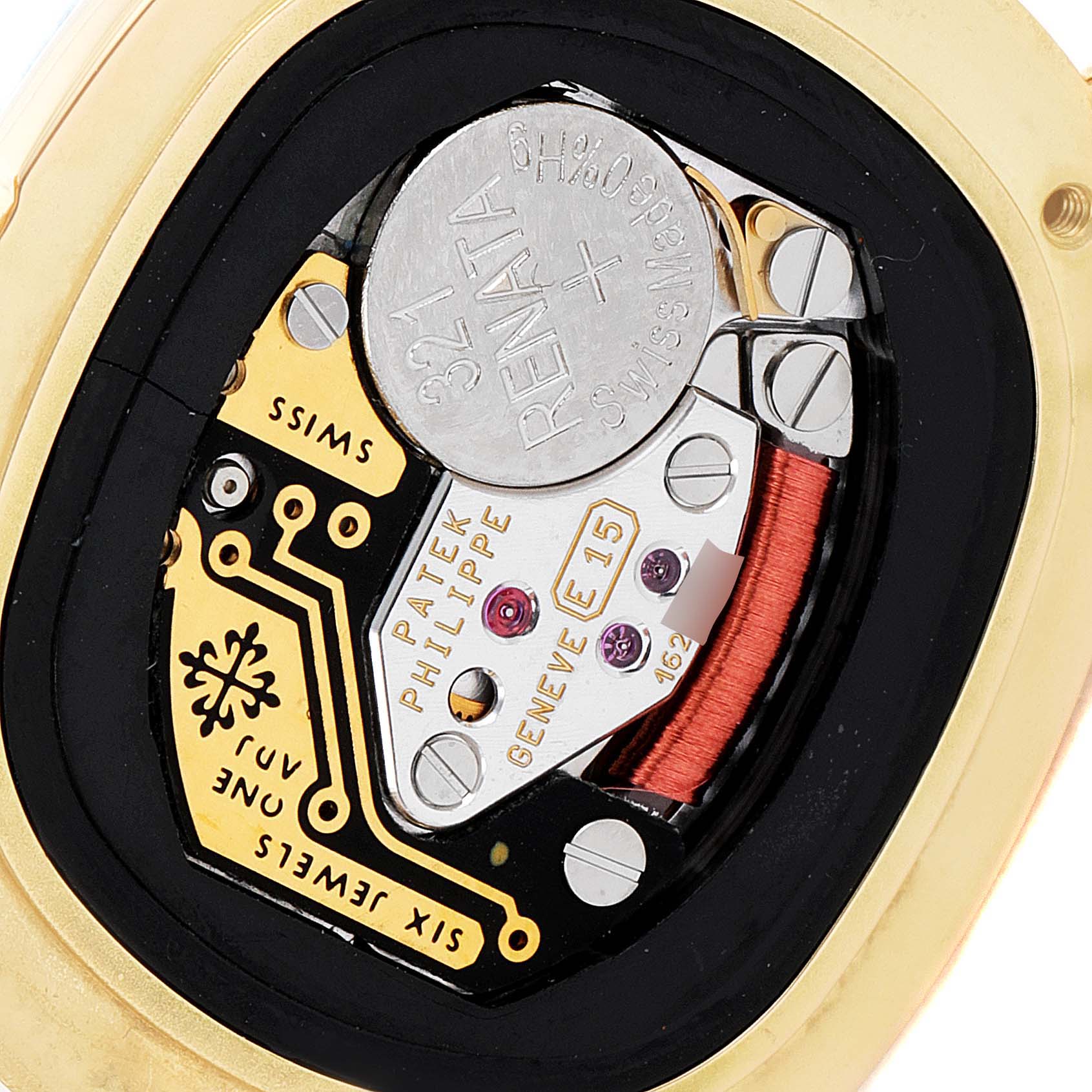 The image shows the internal mechanics and battery compartment of a Patek Philippe Golden Ellipse 4830J Women's Yellow Gold Mother of Pearl Dial 4830J Women's Yellow Gold Mother of Pearl Dial watch from a close-up angle.