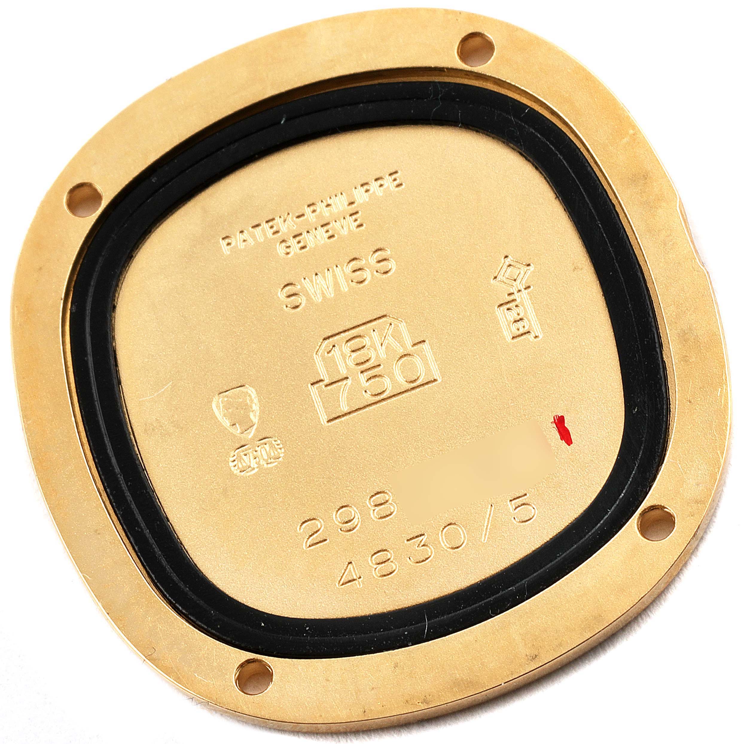 This image shows the back casing of a Patek Philippe Golden Ellipse 4830J Women's Yellow Gold Mother of Pearl Dial 4830J Women's Yellow Gold Mother of Pearl Dial watch, highlighting engravings and hallmark details.