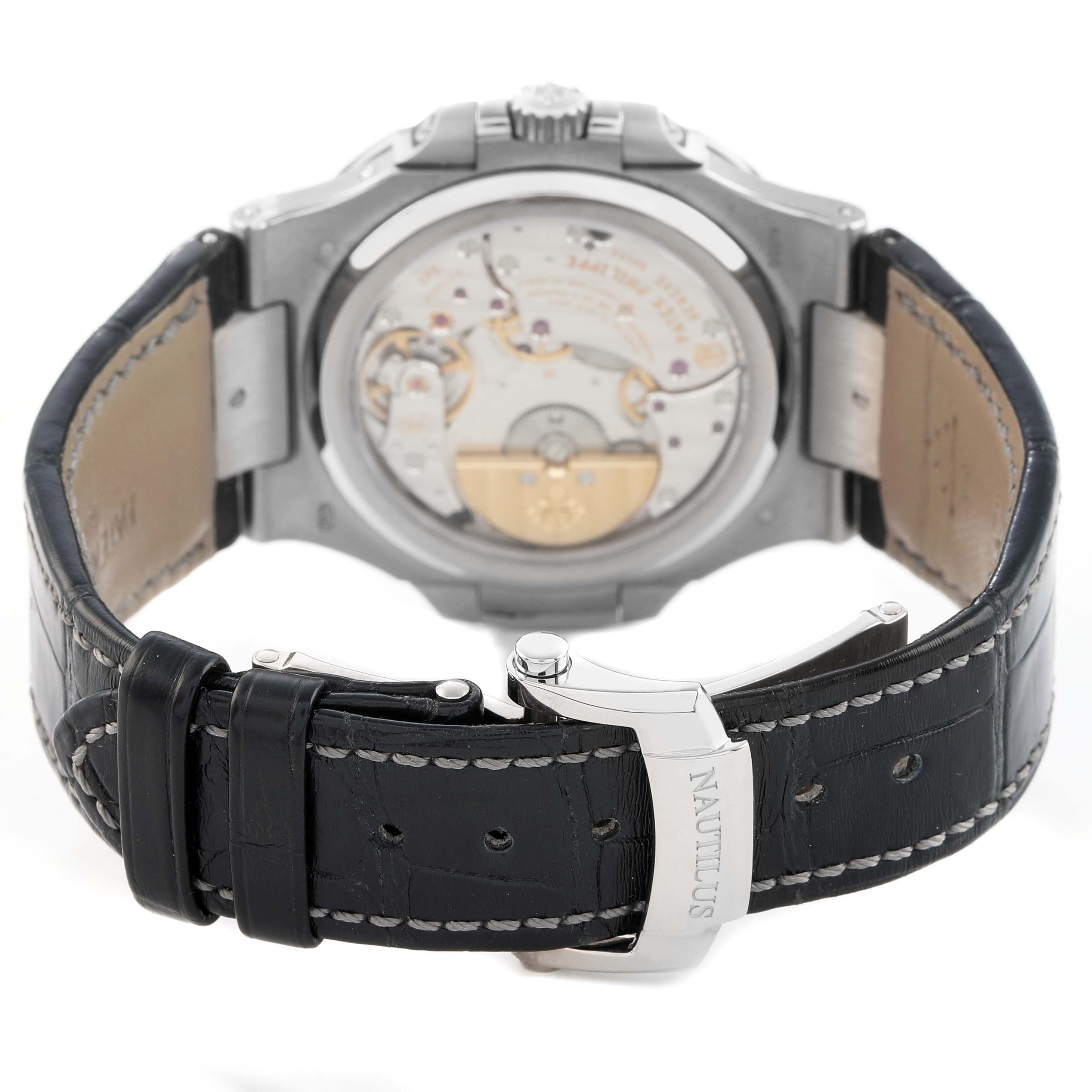 The image shows the back of the Patek Philippe Nautilus 5712G-001 Men's White Gold Grey Dial watch, highlighting the movement and clasp.