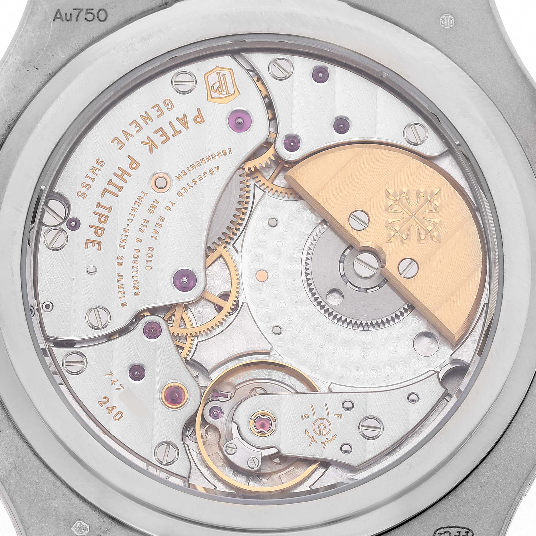 The image shows the back view of the Patek Philippe Nautilus 5712G-001 Men's White Gold Grey Dial, highlighting its intricate movement and rotor.