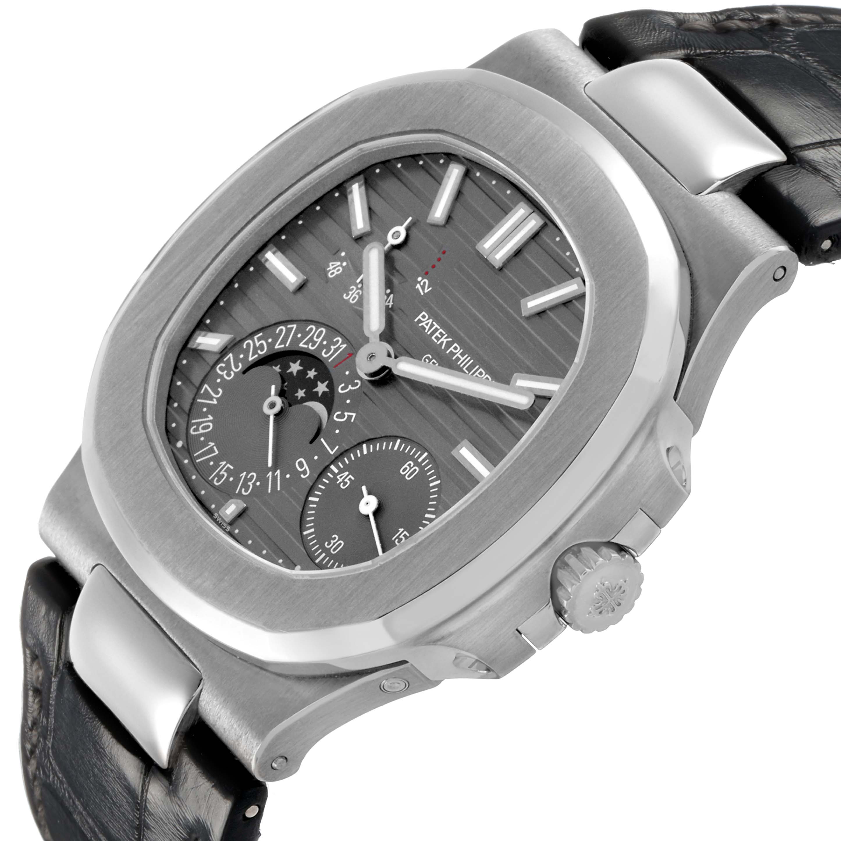 The image shows a Patek Philippe Nautilus 5712G-001 Men's White Gold Grey Dial watch at an angled side view, highlighting the dial, case, strap, and crown.