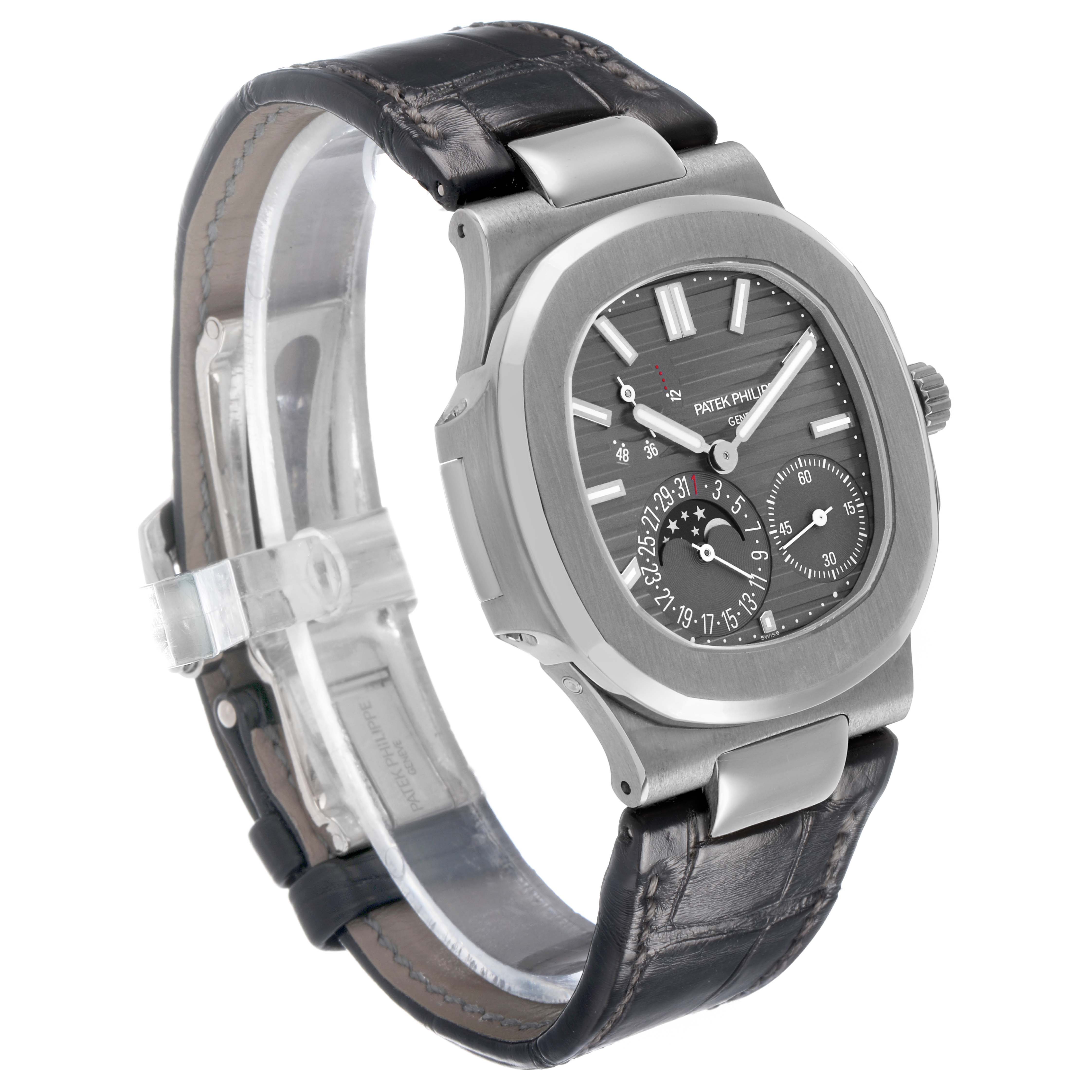 The Patek Philippe Nautilus 5712G-001 Men's White Gold Grey Dial watch is shown at a slight angle, highlighting its face, bezel, and leather strap.