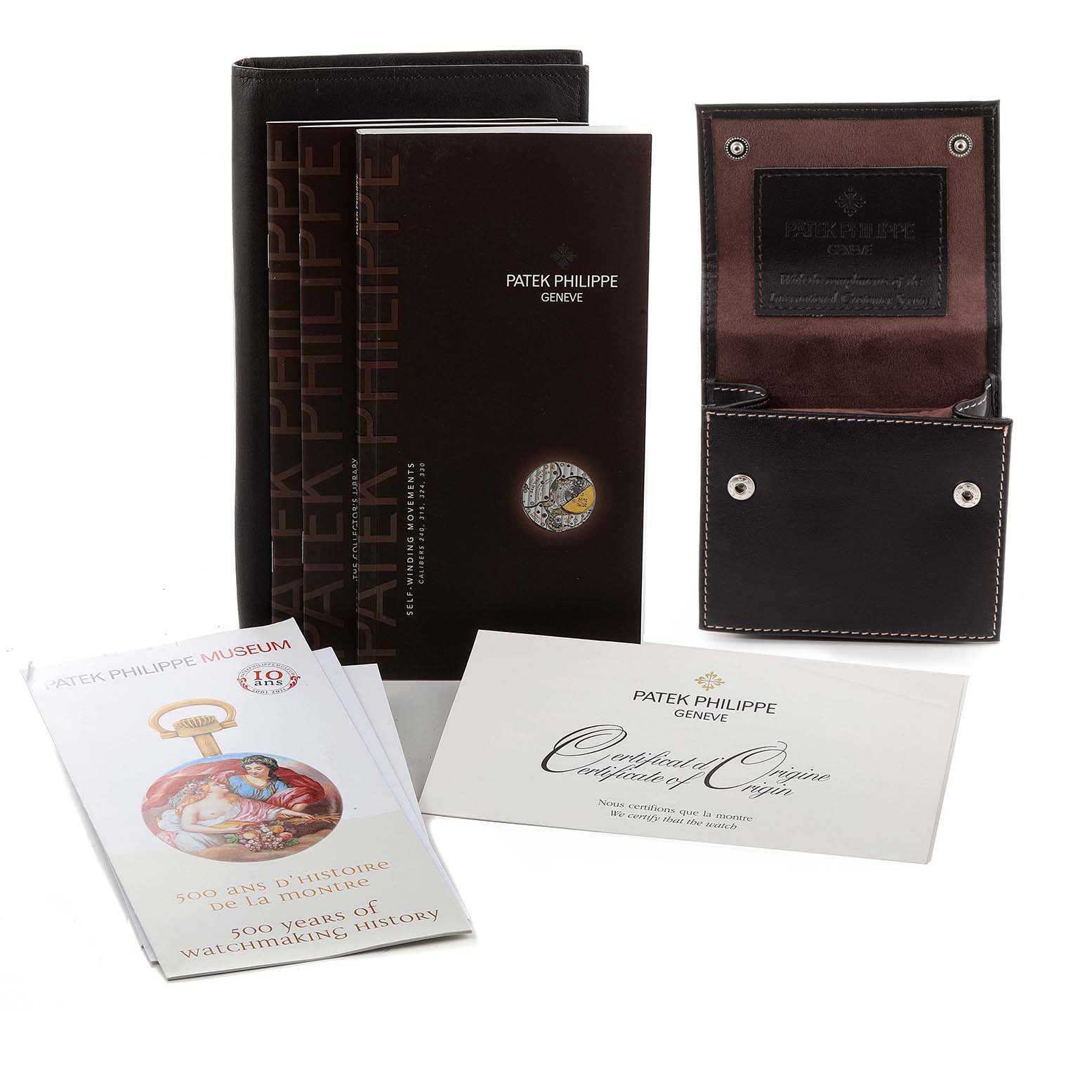 The image shows the packaging and accessories of a Patek Philippe Nautilus 7008/1A 001 Women's Stainless Steel Mother of Pearl Dial 7008/1A 001 Women's Stainless Steel Mother of Pearl Dial watch, including booklets, a certificate, and a leather case.
