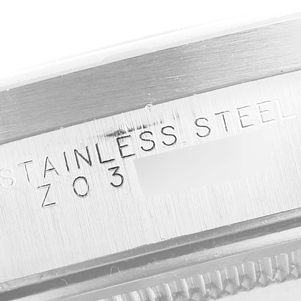 The image shows a close-up of the stainless steel case side of the Rolex Air-King 14010 Men's Stainless Steel Blue Dial 14010 Men's Stainless Steel Blue Dial watch, including engraved text.