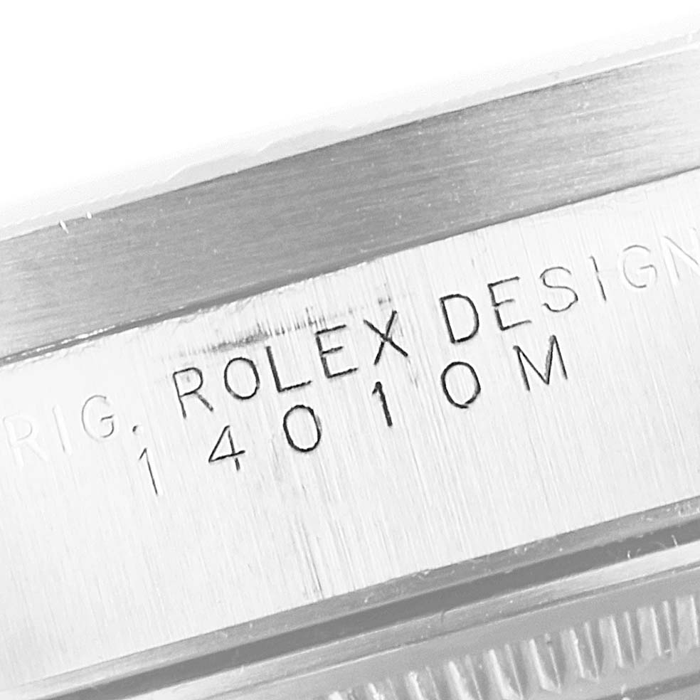 The image shows the engraved model number and "Rolex Design" text on the case of a Rolex Air-King 14010 Men's Stainless Steel Blue Dial 14010 Men's Stainless Steel Blue Dial watch.