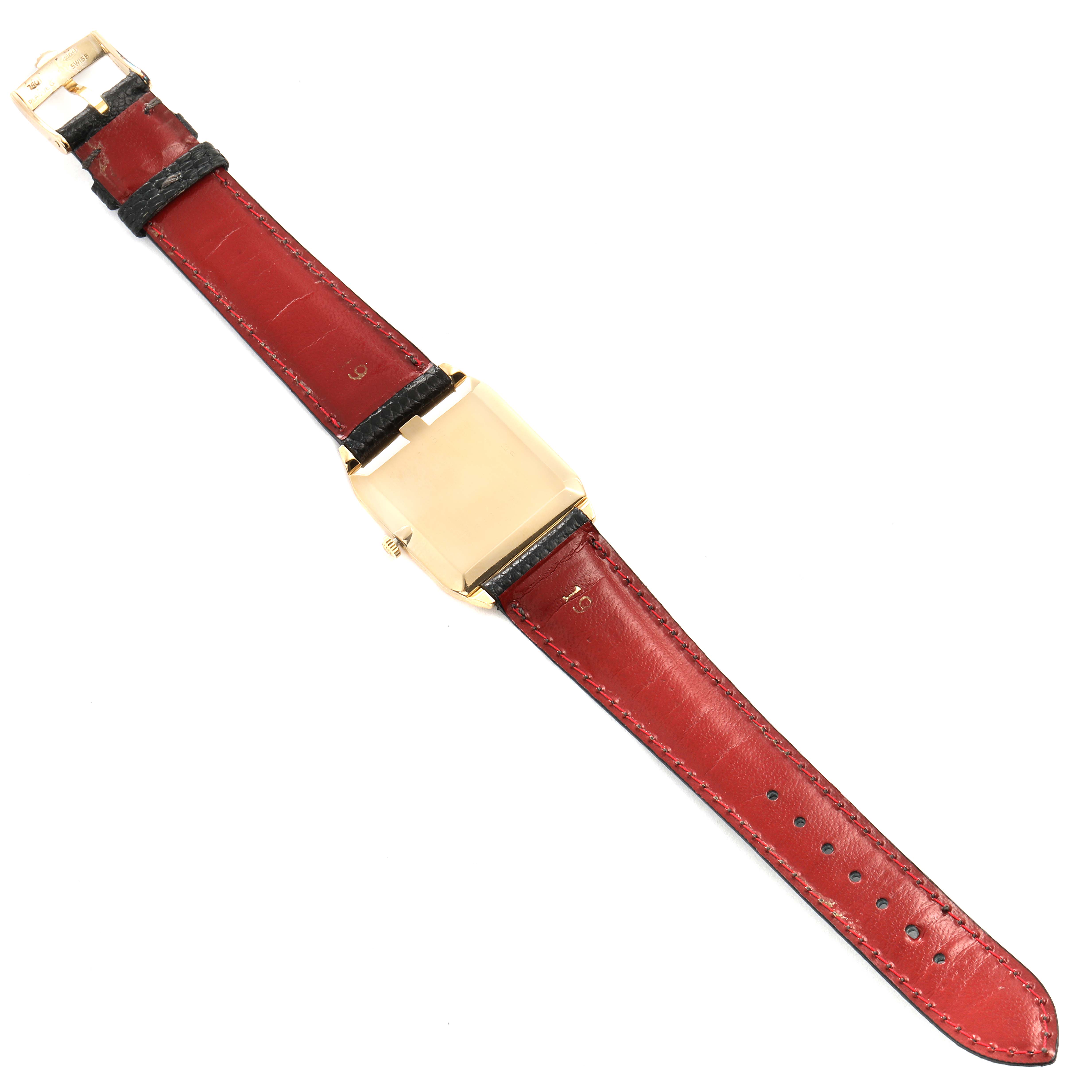 The image shows the back of a Rolex Cellini 4135 Men's Yellow Gold Champagne Dial 4135 Men's Yellow Gold Champagne Dial watch with a red leather strap, displayed horizontally.