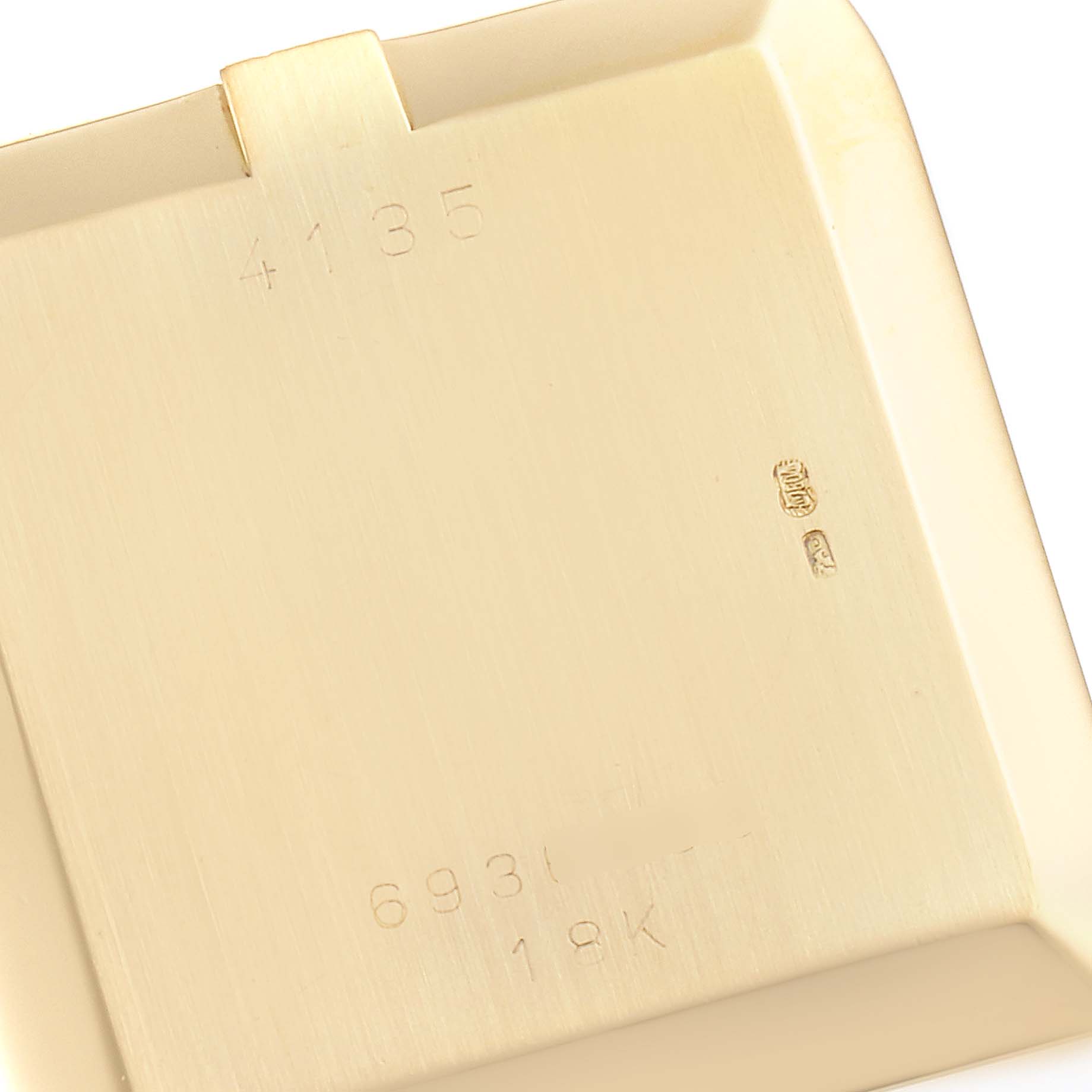 This image shows the back case of a Rolex Cellini 4135 Men's Yellow Gold Champagne Dial 4135 Men's Yellow Gold Champagne Dial model watch, with engravings and hallmarks visible.