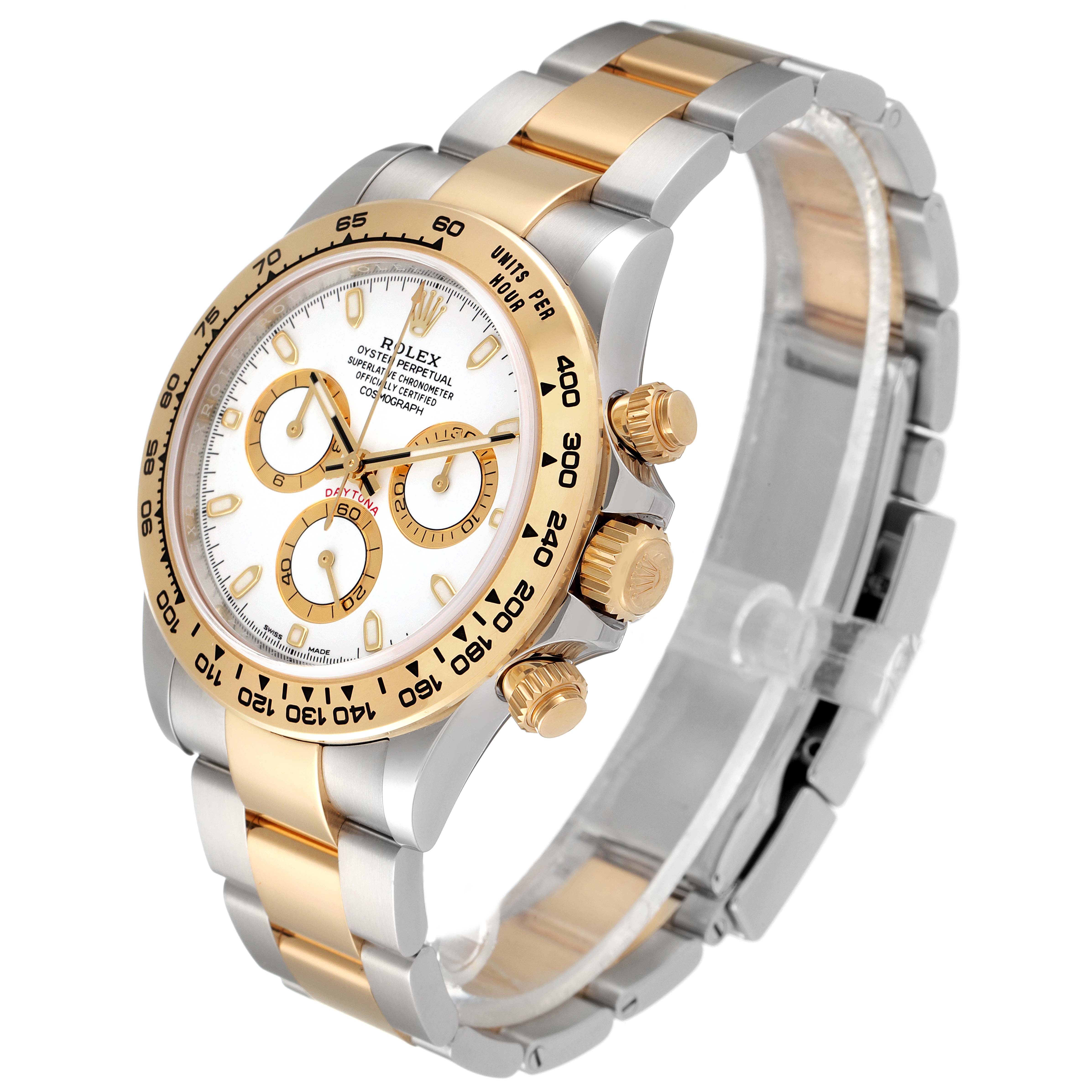 The Rolex Daytona 116503 Men
s Steel and Gold (two tone) White Dial 116503 Men
s Steel and Gold (two tone) White Dial watch is shown at a three-quarter angle, featuring its face, bezel, crown, and two-tone bracelet.