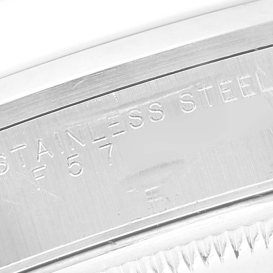 The image shows a close-up of the inner bezel engraving on a Rolex Date 15200 Men's Stainless Steel Blue Dial 15200 Men's Stainless Steel Blue Dial watch, focusing on the "STAINLESS STEEL" text.