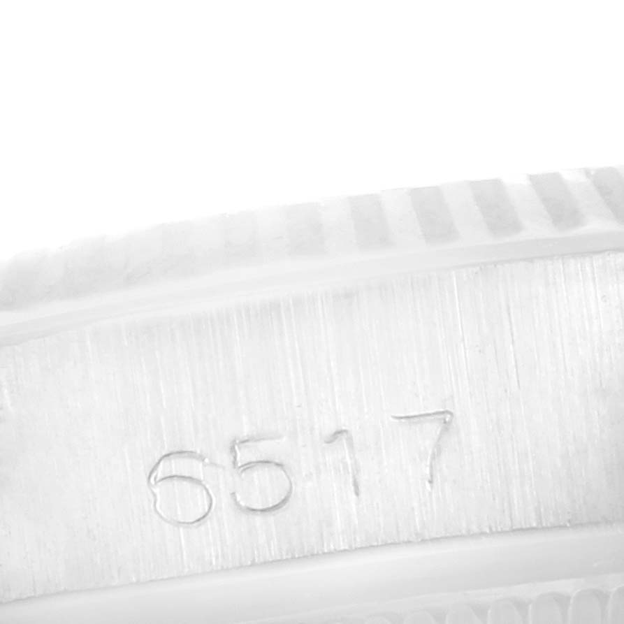 The image shows a close-up of the engraved serial number "6517" on a Rolex Date 6517 Women's Stainless Steel Silver Dial 6517 Women's Stainless Steel Silver Dial model watch case.