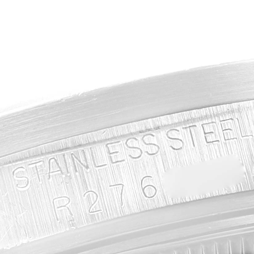 This image shows a close-up of the engraved stainless steel part of a Rolex Date 15010 Men's Stainless Steel Black Dial 15010 Men's Stainless Steel Black Dial model watch.
