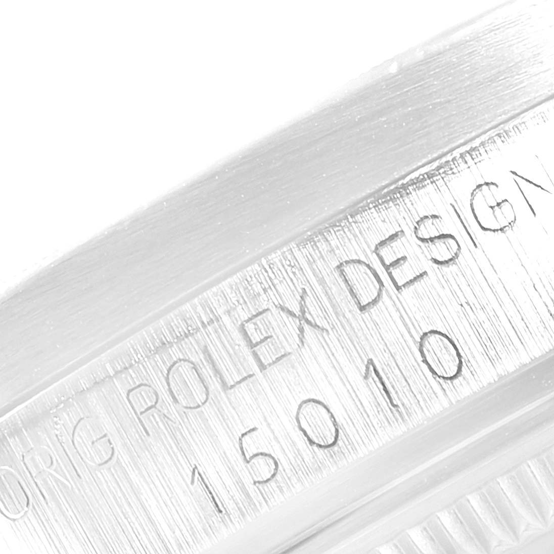 The image shows a close-up of the engraved inner bezel of a Rolex Date 15010 Men's Stainless Steel Black Dial 15010 Men's Stainless Steel Black Dial model.