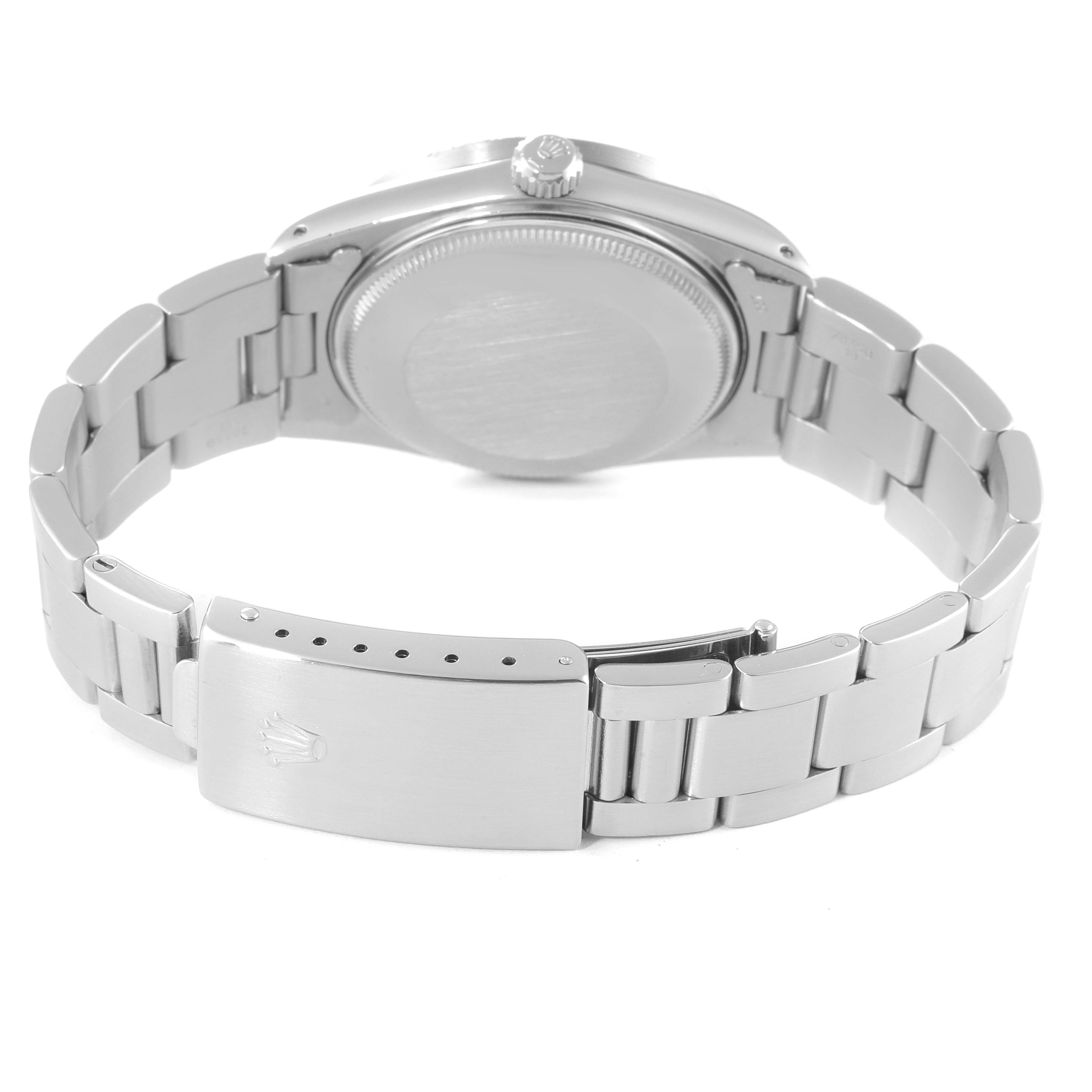 This image of the Rolex Date 15010 Men's Stainless Steel Black Dial 15010 Men's Stainless Steel Black Dial model watch shows the back case, crown, and stainless steel bracelet with clasp.