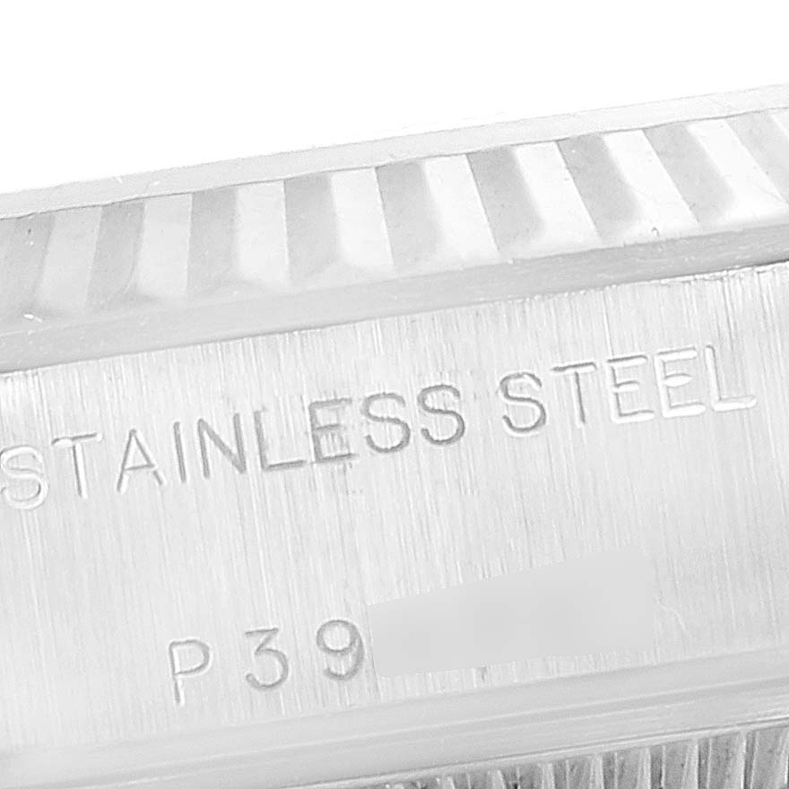 The image shows a close-up of the stainless steel caseback of a Rolex Datejust 79174 Women's Stainless Steel Pink Dial 79174 Women's Stainless Steel Pink Dial watch with engraved text.