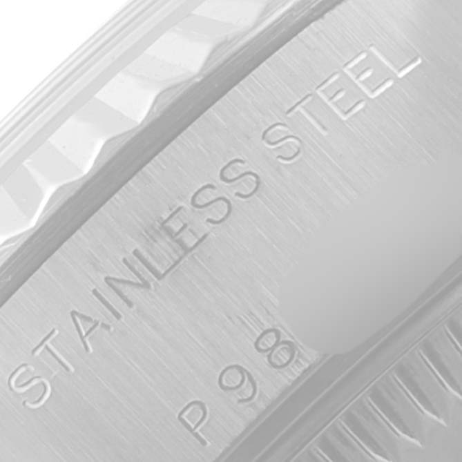 This close-up image shows the engraving on the stainless steel bezel of a Rolex Datejust 79174 Women
s Stainless Steel Silver Dial 79174 Women
s Stainless Steel Silver Dial watch.