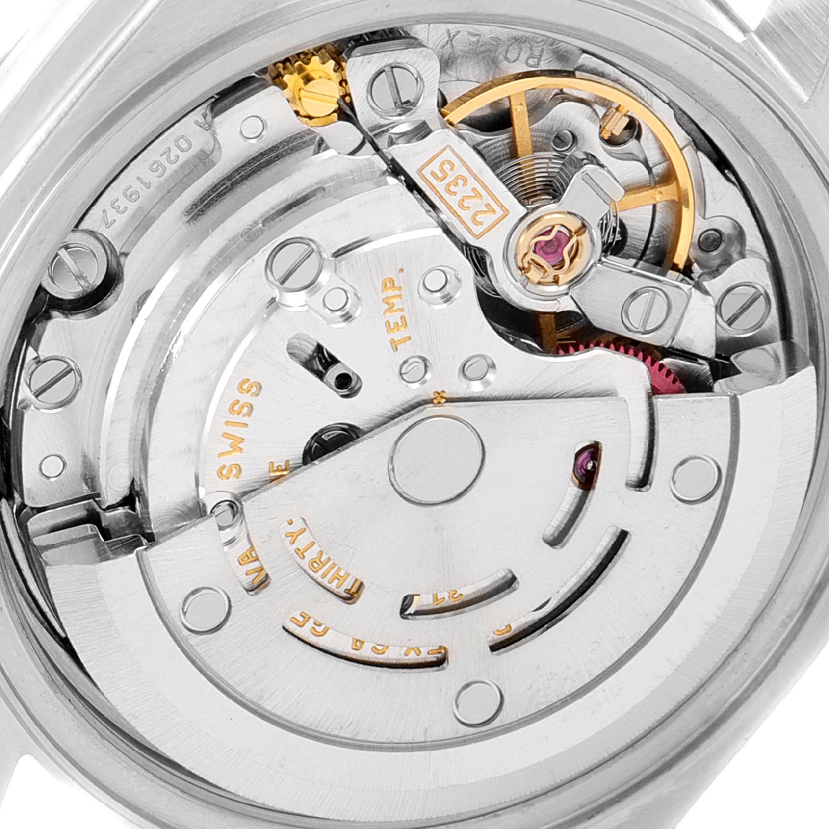 The image shows a close-up view of the movement inside a Rolex Datejust 79174 Women
s Stainless Steel Silver Dial 79174 Women
s Stainless Steel Silver Dial watch, highlighting the intricate internal components.