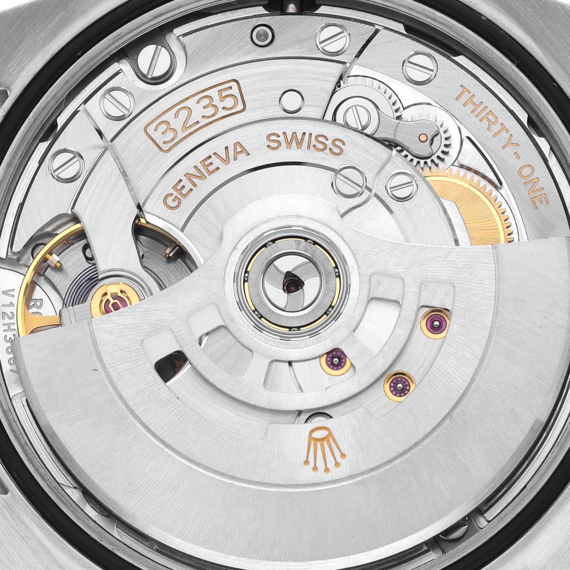 The image shows a top view of the Rolex Datejust 126200 Men's Stainless Steel Black Dial 126200 Men's Stainless Steel Black Dial's movement, highlighting the rotor and intricate mechanical details.