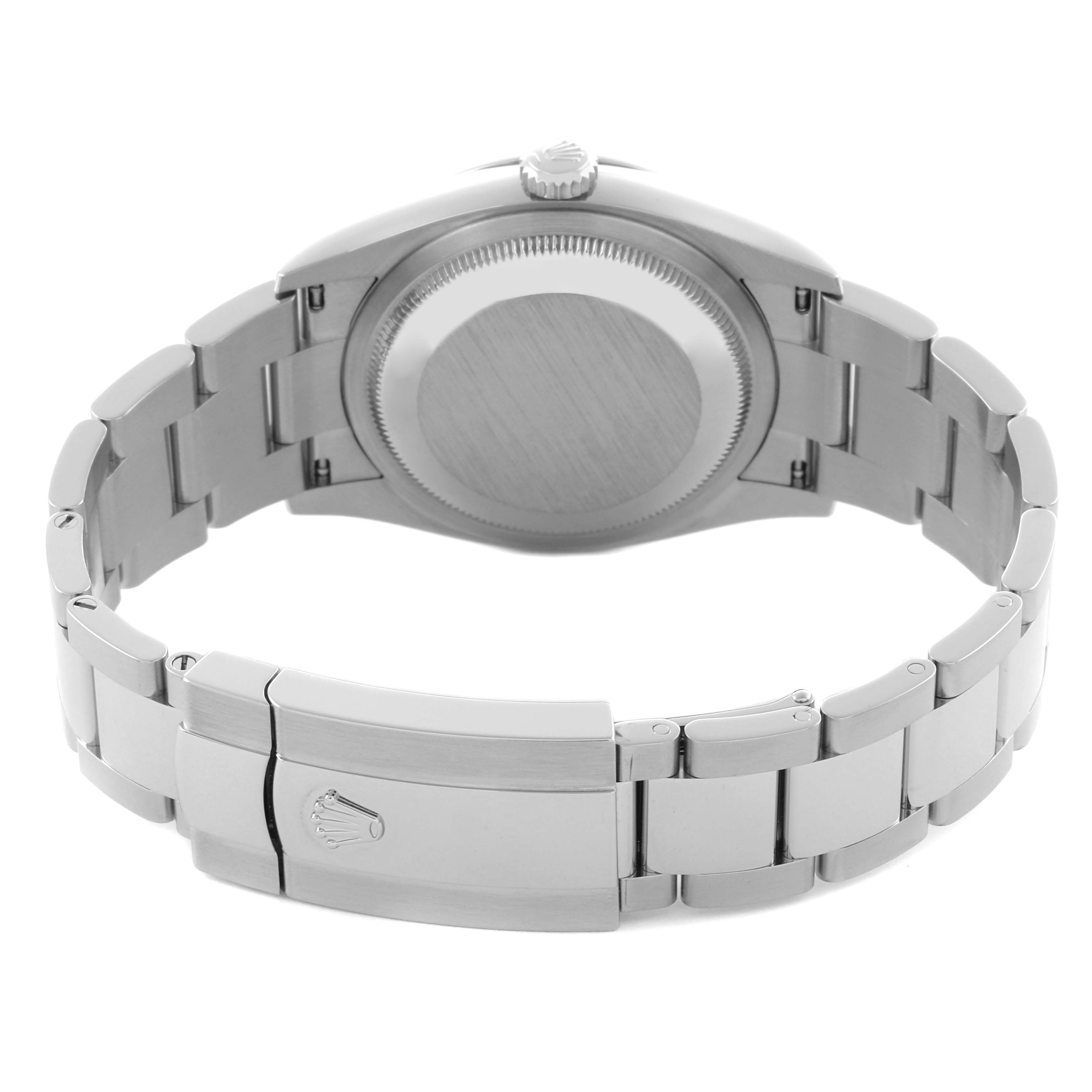 The image shows the back view of a Rolex Datejust 126200 Men's Stainless Steel Black Dial 126200 Men's Stainless Steel Black Dial watch, focusing on the case back and metal bracelet with clasp.