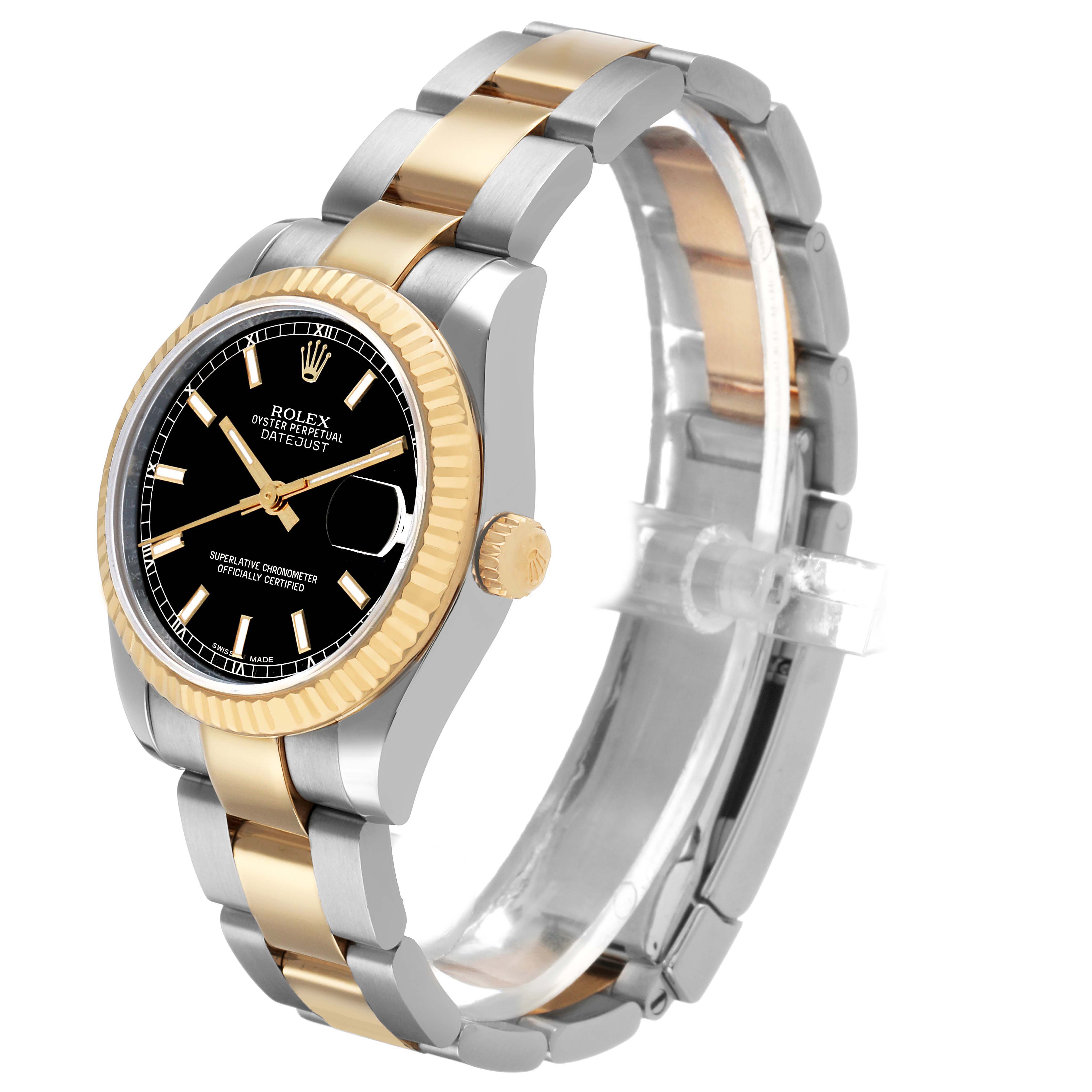The Rolex Datejust 178273 Women's Steel and Gold (two tone) Black Dial watch is shown at a three-quarter angle displaying the face, bezel, crown, and two-tone bracelet.
