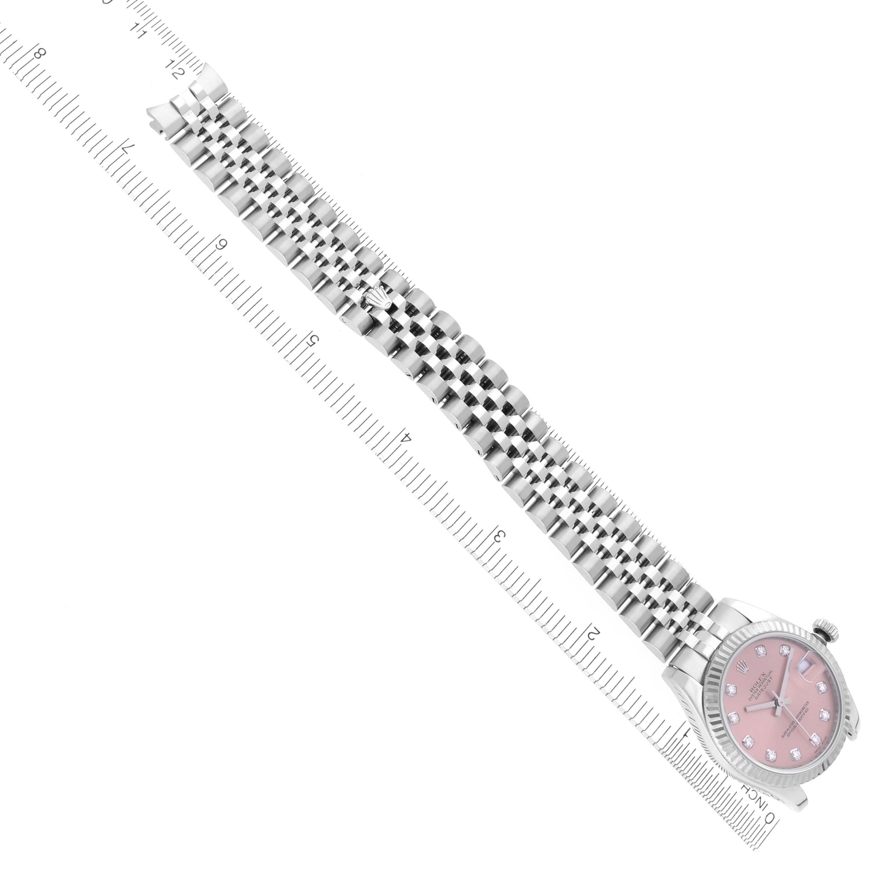The Rolex Mid-Size 178274 Women's Stainless Steel Pink Dial 178274 Women's Stainless Steel Pink Dial watch is shown at an oblique angle, highlighting the bracelet and a pink dial with diamond markers.