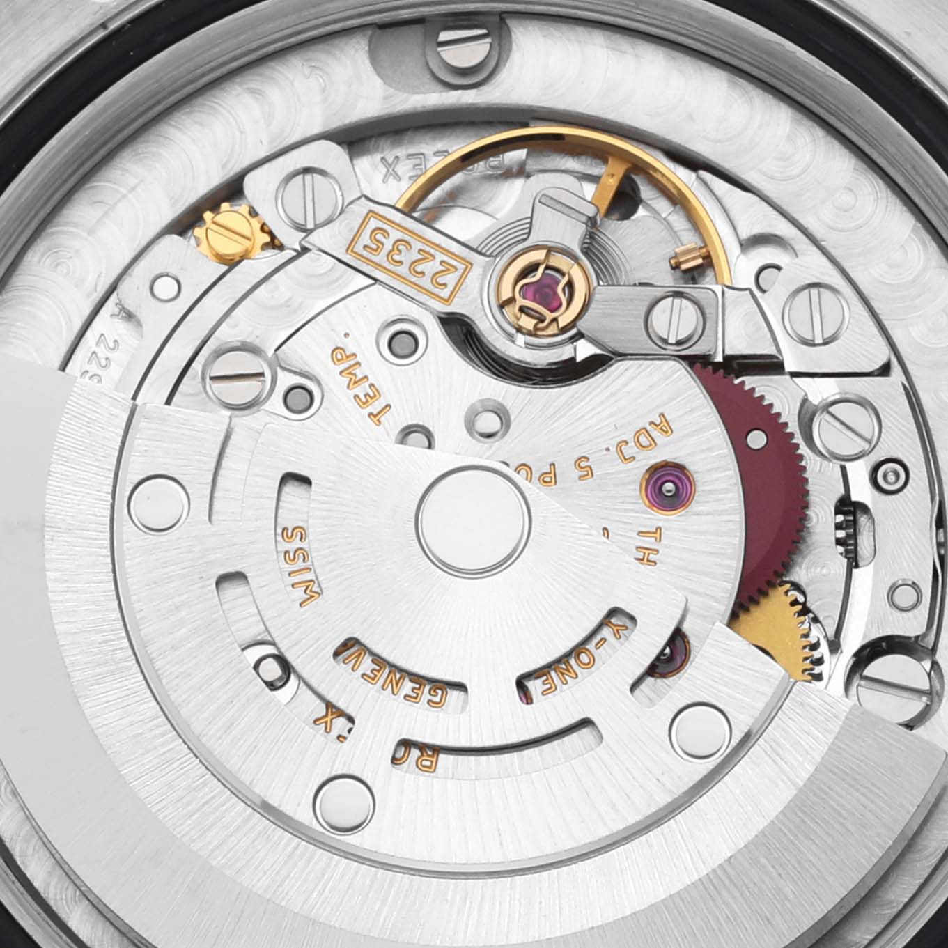 The image shows the intricate movement of a Rolex Mid-Size 178274 Women's Stainless Steel Pink Dial 178274 Women's Stainless Steel Pink Dial model watch from a top angle, highlighting gears and the rotor.