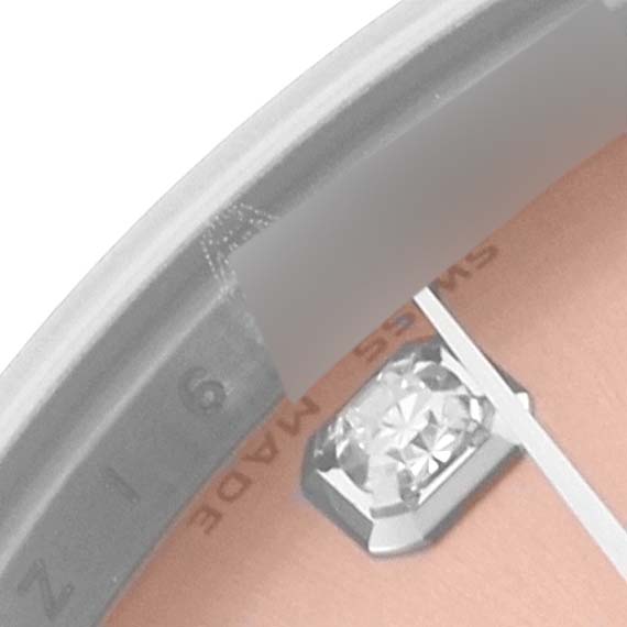 The image shows a close-up of the Rolex Mid-Size 178274 Women's Stainless Steel Pink Dial 178274 Women's Stainless Steel Pink Dial watch face, displaying a diamond hour marker and partial text.