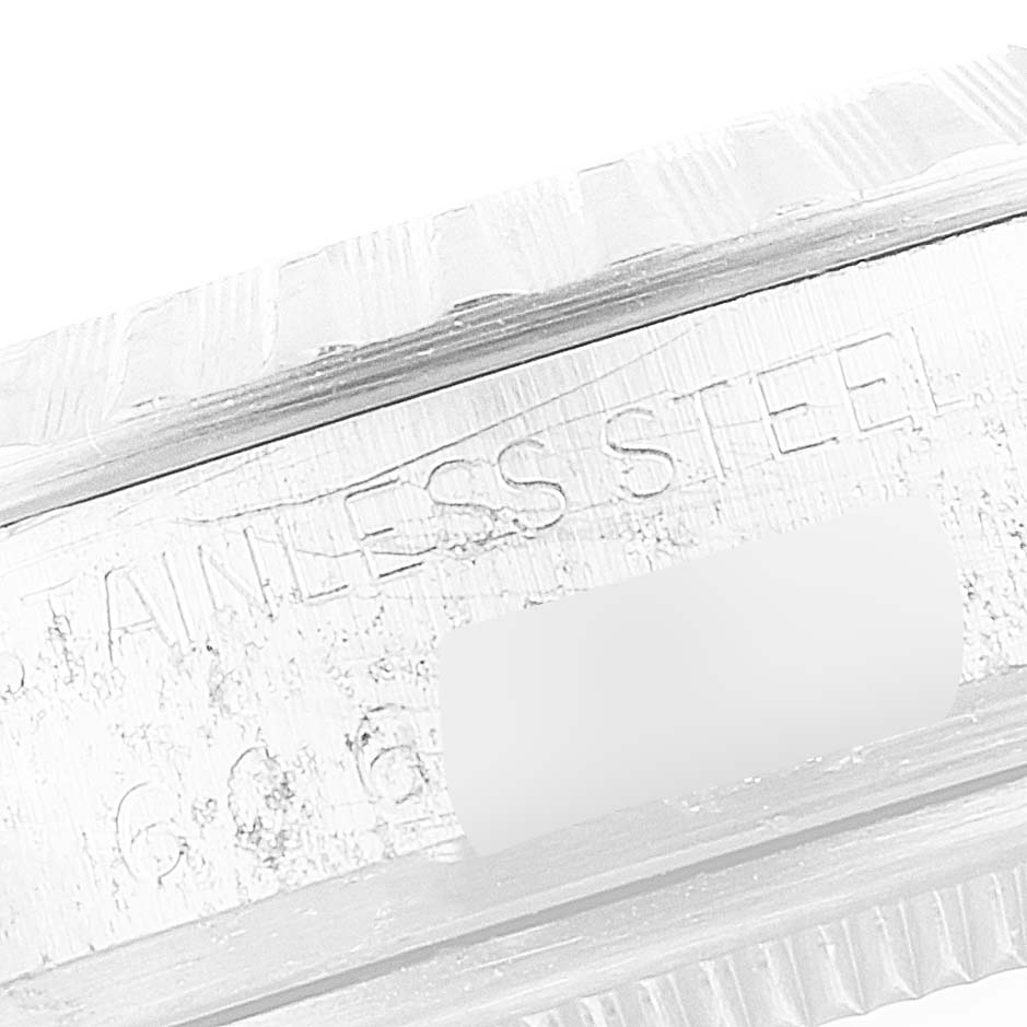 This image displays a close-up of the side of a Rolex Vintage Collection 16030 Men's Stainless Steel Silver Dial 16030 Men's Stainless Steel Silver Dial watch, specifically showing part of the case with "STAINLESS STEEL" engraving.