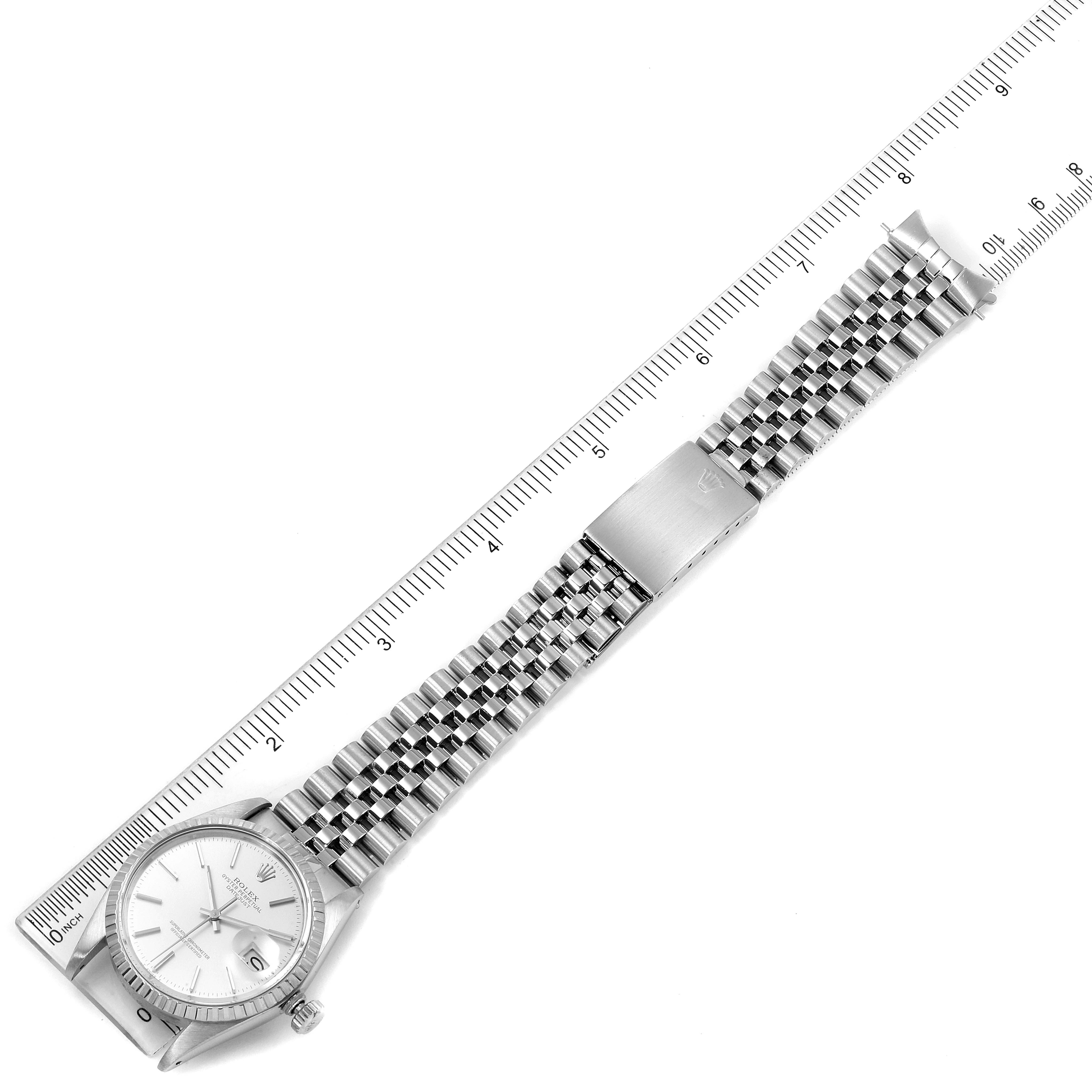 The image shows a top-down view of a Rolex Vintage Collection 16030 Men's Stainless Steel Silver Dial 16030 Men's Stainless Steel Silver Dial watch, displaying the face, bezel, crown, and metal bracelet with a measuring scale.