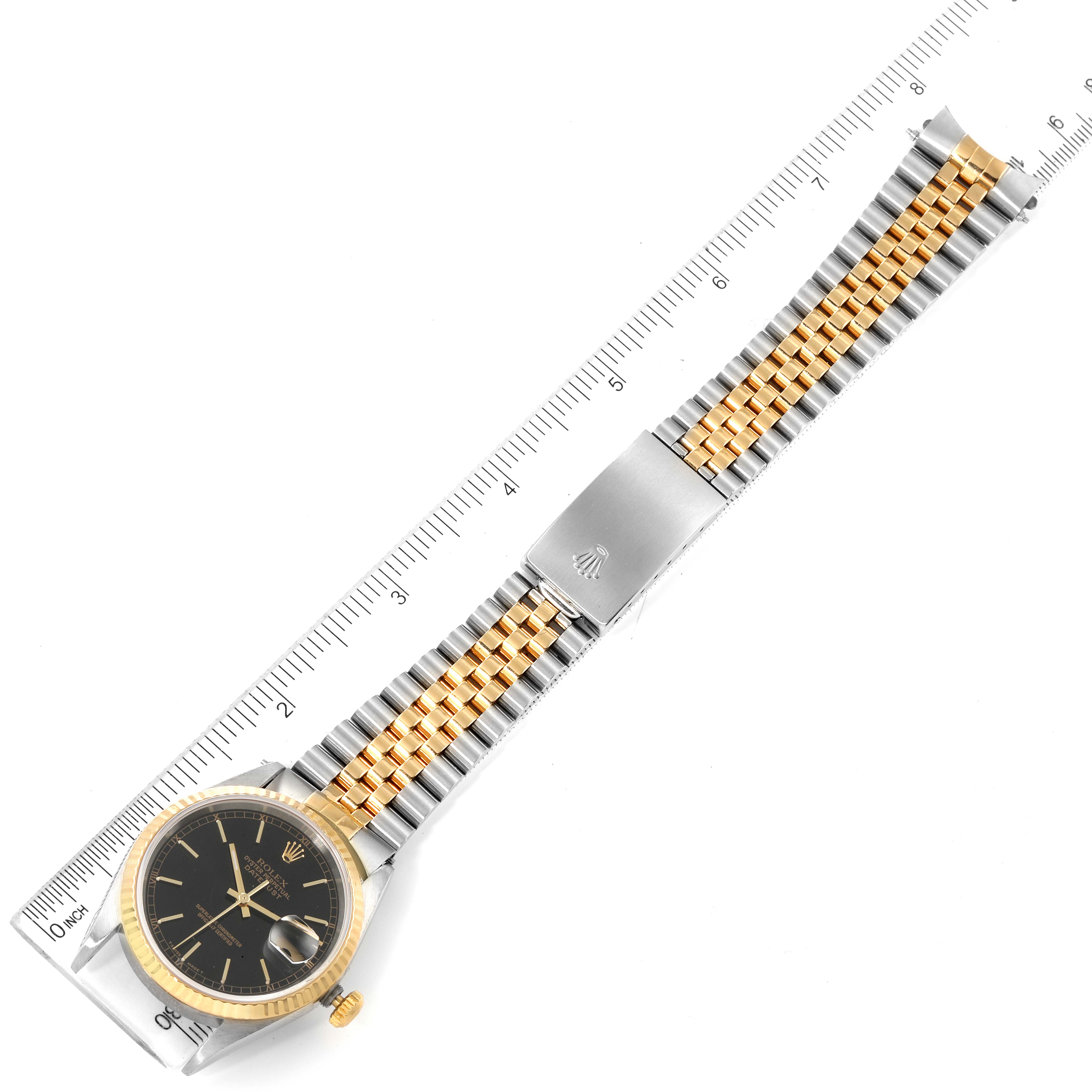 This image shows a top-down view of a Rolex Datejust 16233 Men's Steel and Gold (two tone) Black Dial 16233 Men's Steel and Gold (two tone) Black Dial watch, focusing on the dial, bezel, and full bracelet.