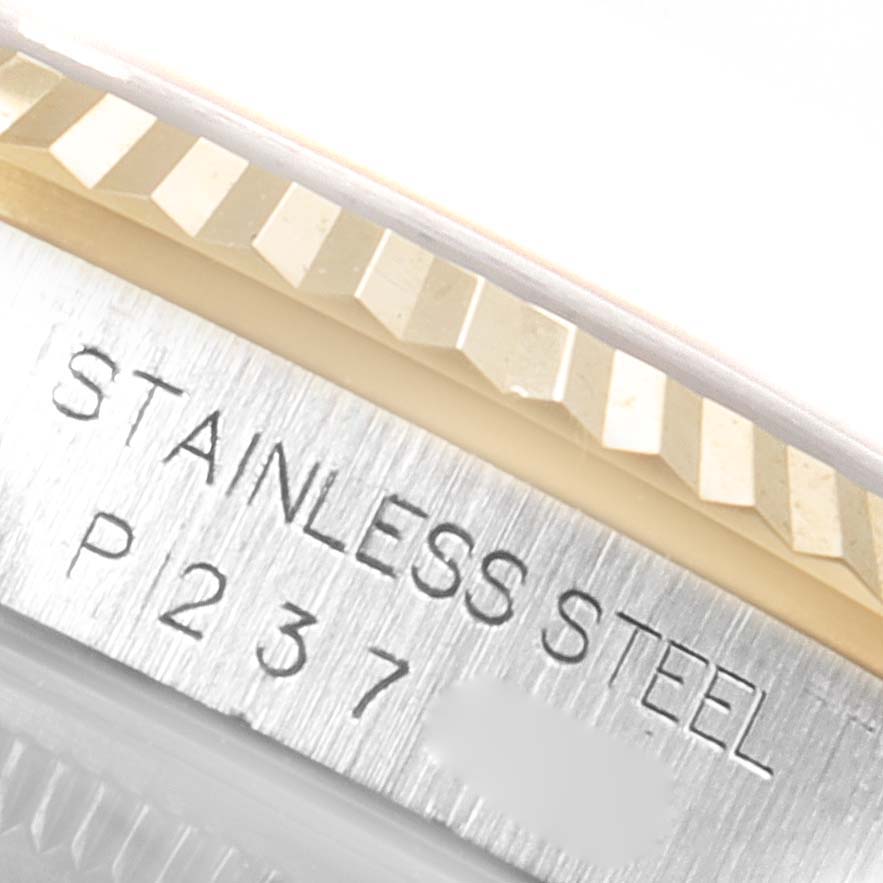 Close-up of the Rolex Datejust 16233 Men's Steel and Gold (two tone) White Dial 16233 Men's Steel and Gold (two tone) White Dial model showing the stainless steel case back and part of the fluted bezel.