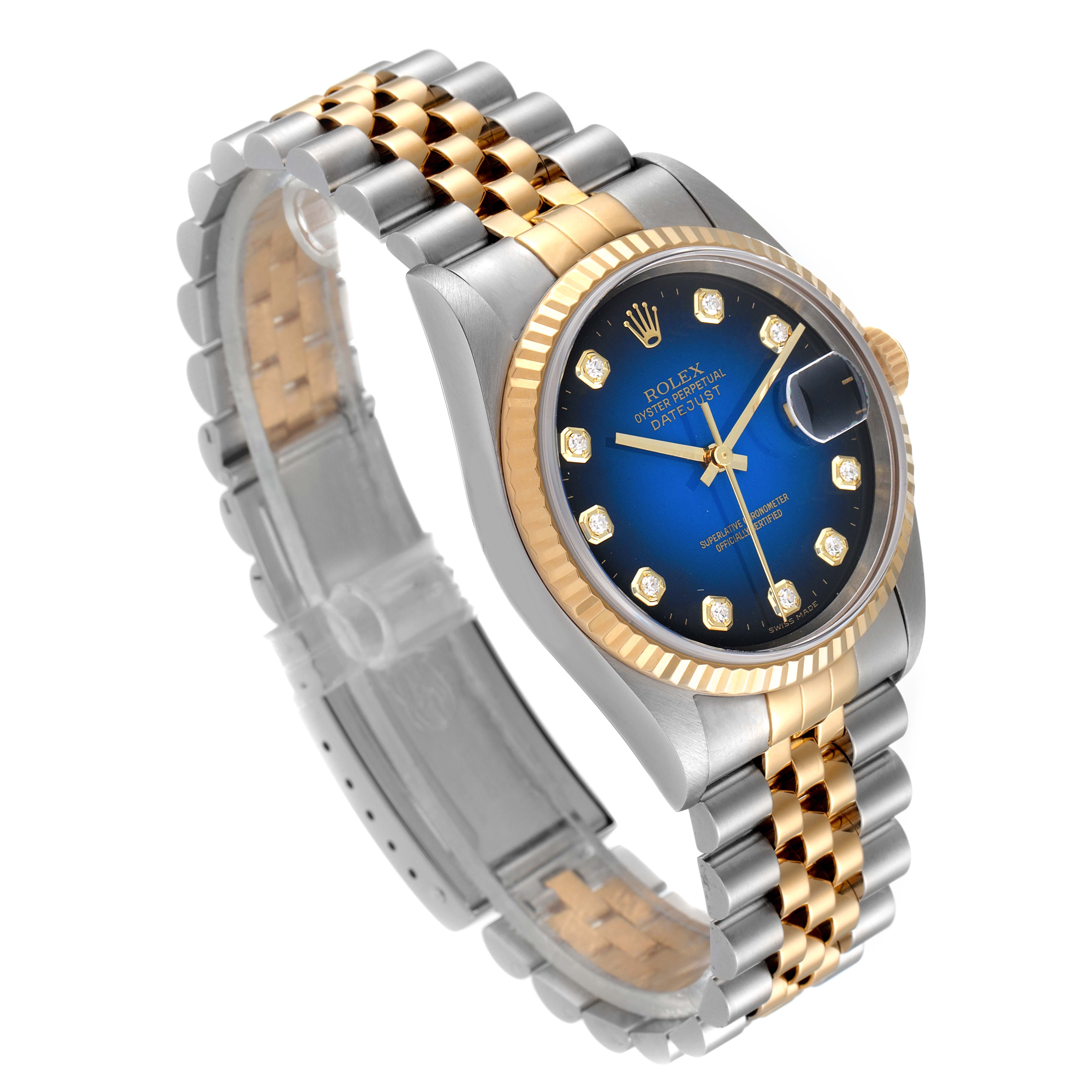 This Rolex Datejust 16233 Men's Steel and Gold (two tone) Blue Dial 16233 Men's Steel and Gold (two tone) Blue Dial watch is shown at an angled view, displaying its blue dial, gold fluted bezel, and two-tone Jubilee bracelet.